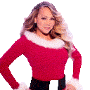 Woman with blonde curly hair wearing a red and white sweater, standing with hands on hips.