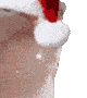 Close-up of a Santa hat with a pom-pom, hanging on a textured surface.