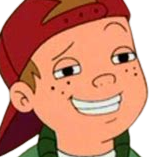 Close-up of a cartoon boy with freckles, wearing a red hat, smiling confidently.