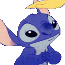 Close-up of a small, animated blue alien character with large eyes and a happy expression.