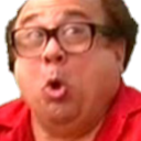 Close-up of a person with glasses making a surprised or exaggerated facial expression