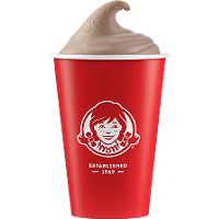 A red Wendy's cup with a swirl of frozen chocolate Frosty inside.