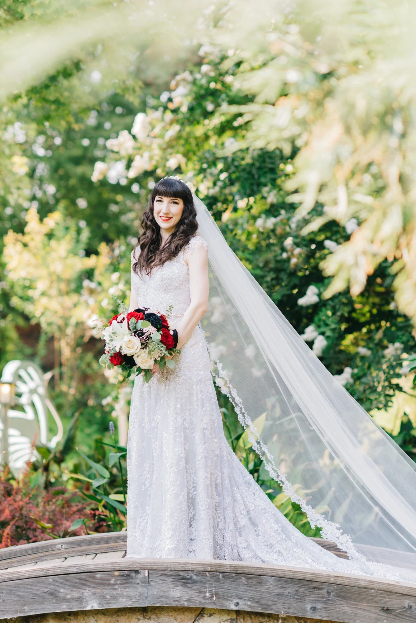 bride with fair skin and red lipstick done by georgia wedding makeup artist at the team of muse bridal artistry