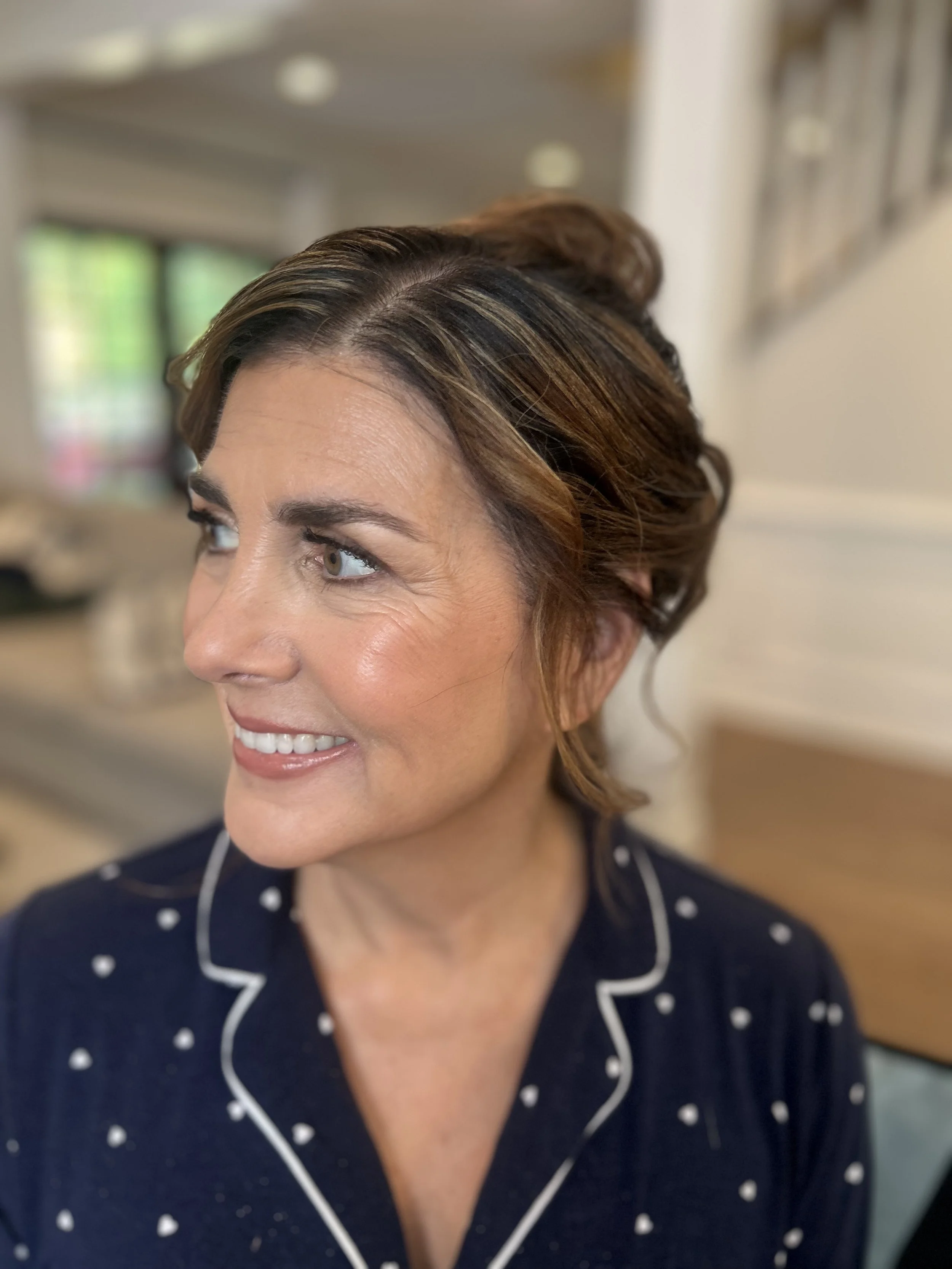 Mother of the bride with warm-toned glam makeup by Atlanta wedding makeup artist