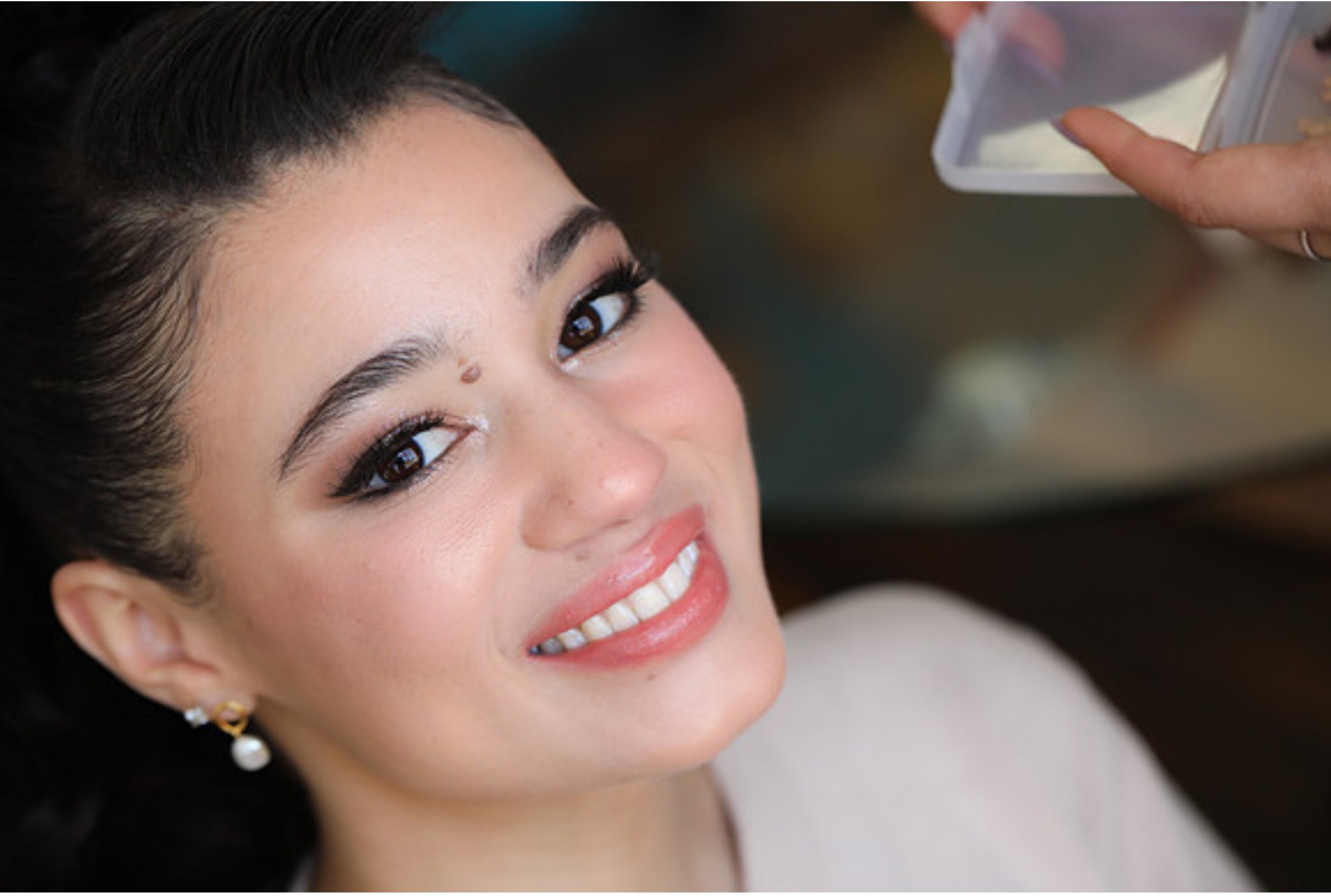 Bride getting ready makeup session with Atlanta wedding makeup artist