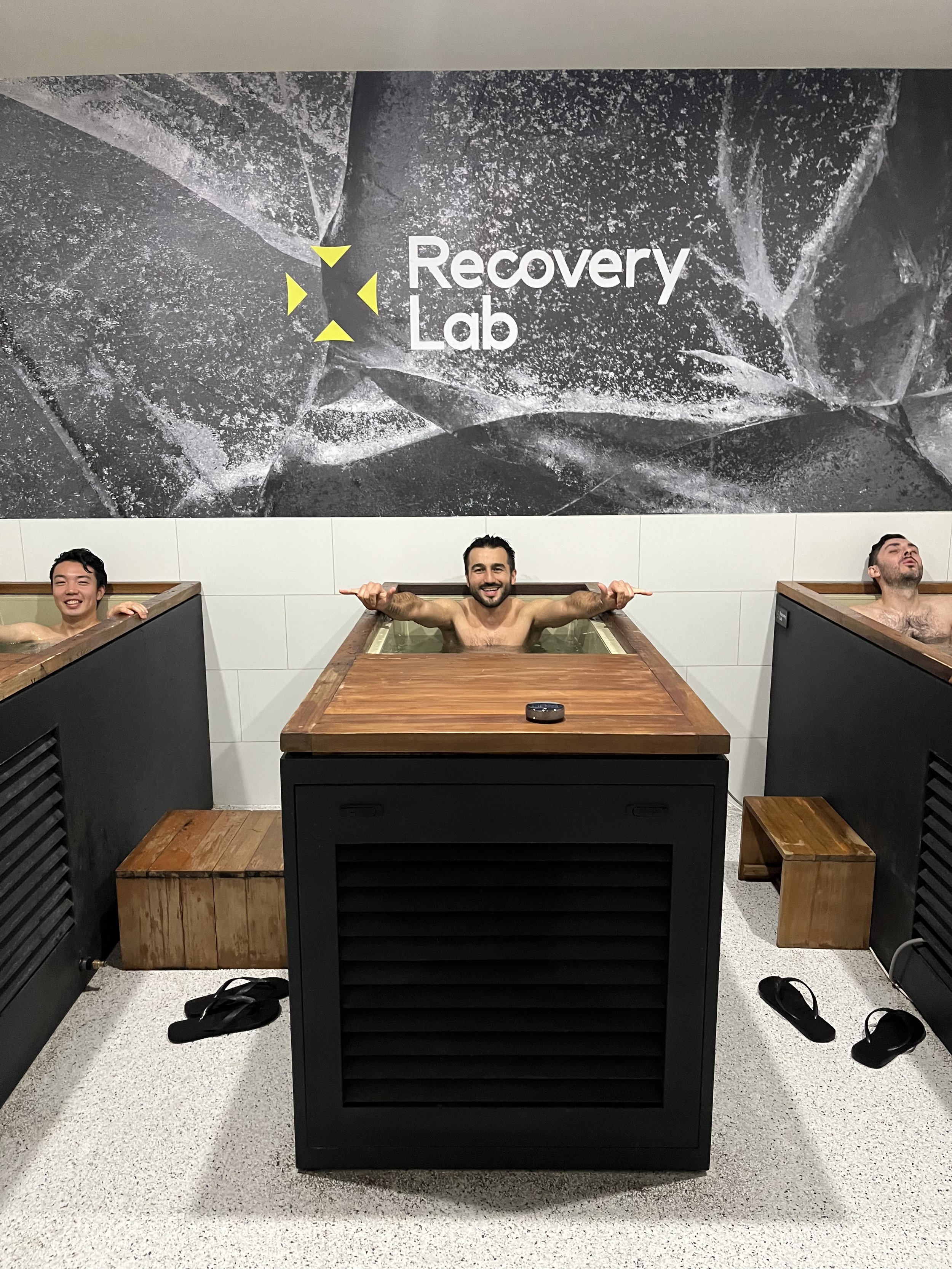 Clients enjoying hot & cold water therapy as part of a contrast recovery experience at Recovery Lab Maribyrnong.