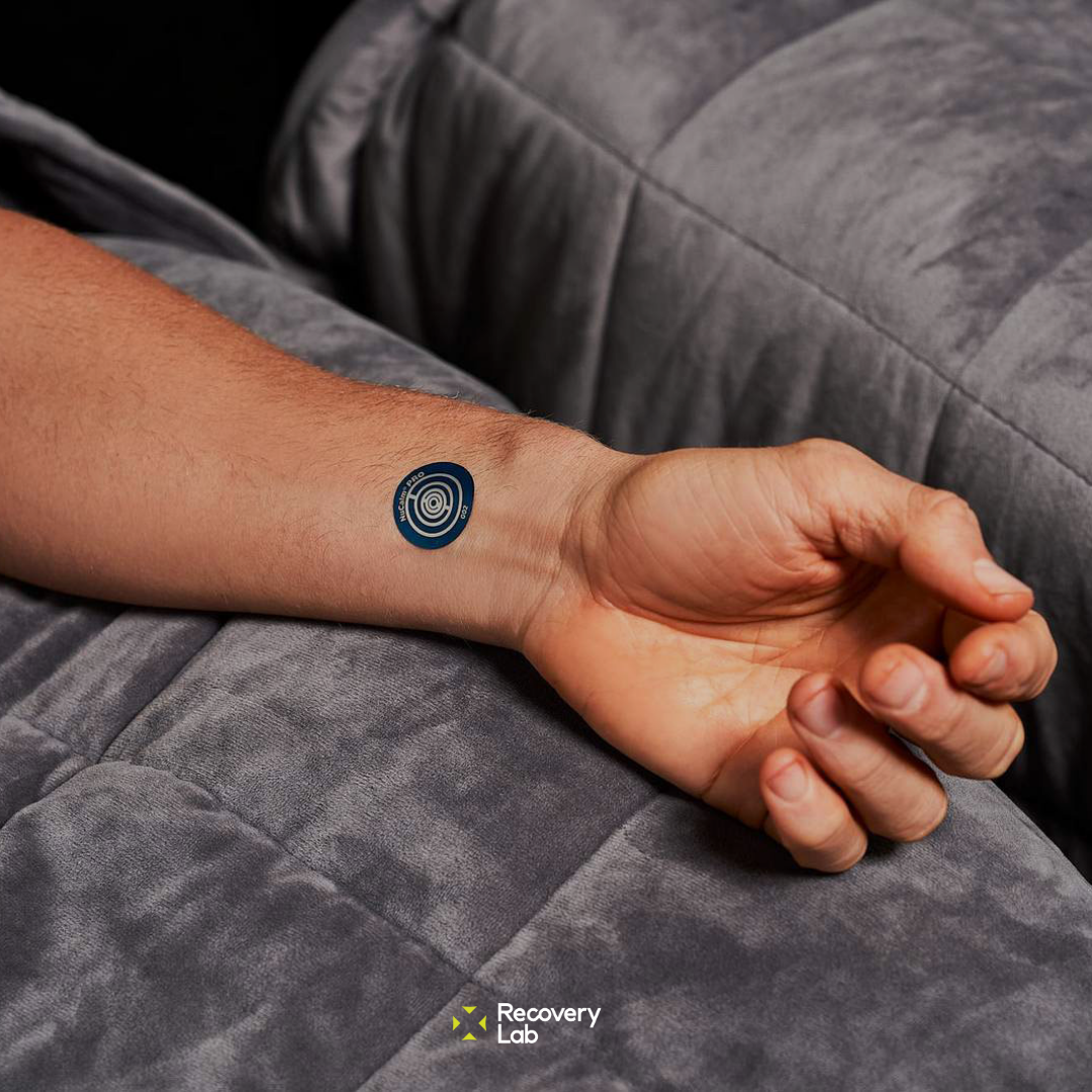 NuCalm biosignal disc used during a relaxation session at Recovery Lab Maribyrnong