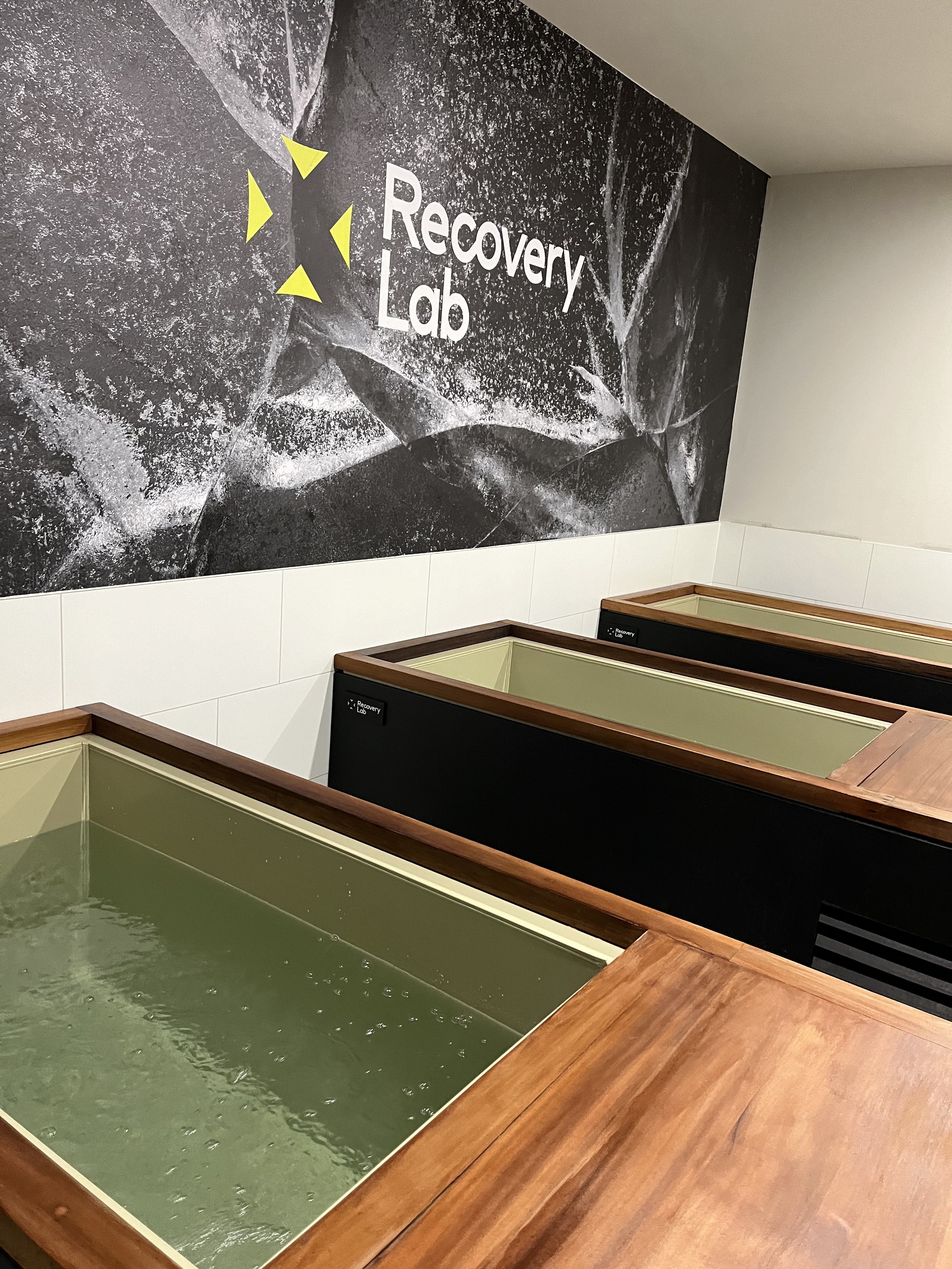 Cold plunge and contrast therapy area at Recovery Lab Maribyrnong featuring multiple immersion baths in a calm, private studio setting.