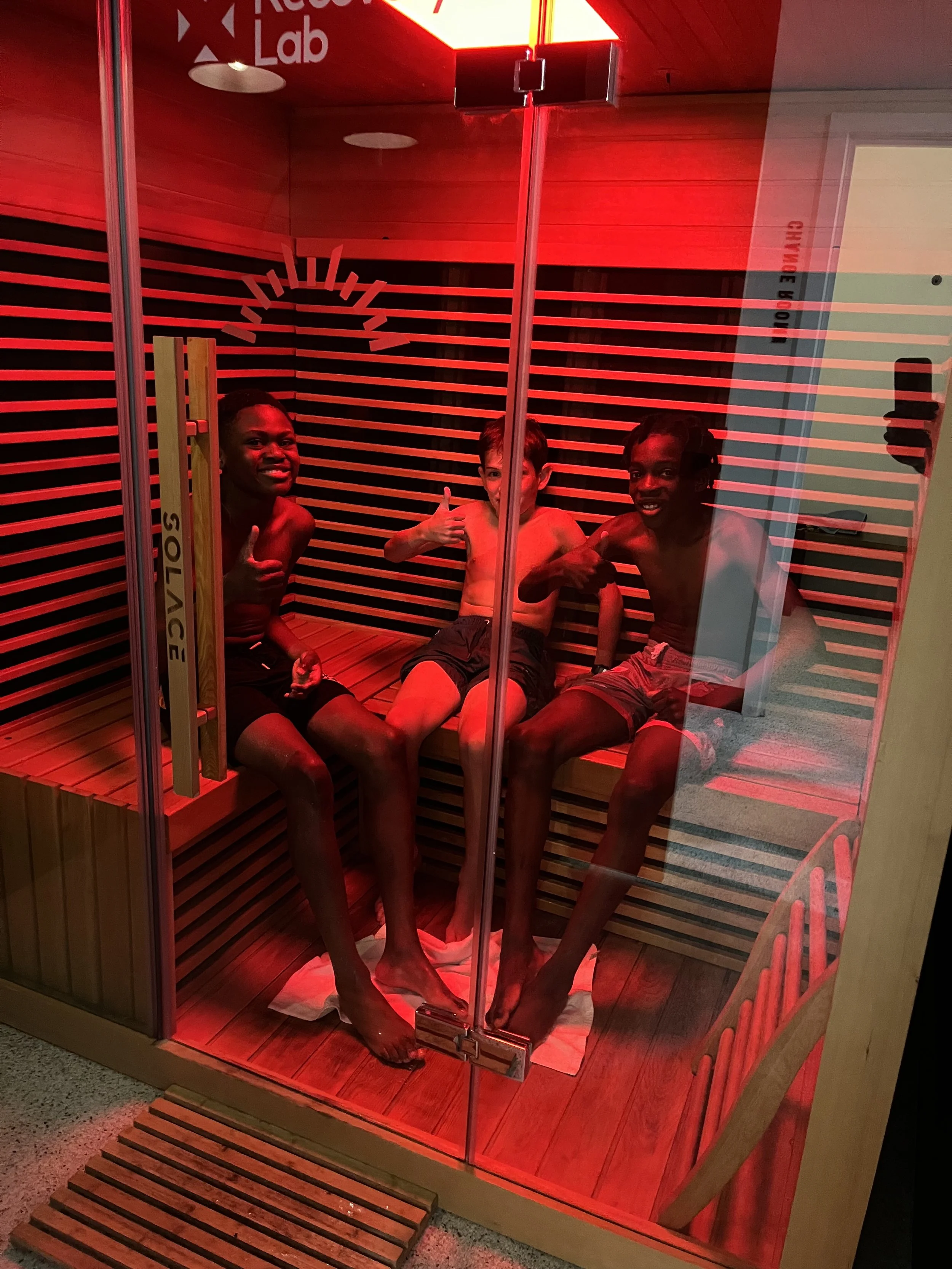 Group infrared sauna session at Recovery Lab Maribyrnong as part of a guided recovery experience.