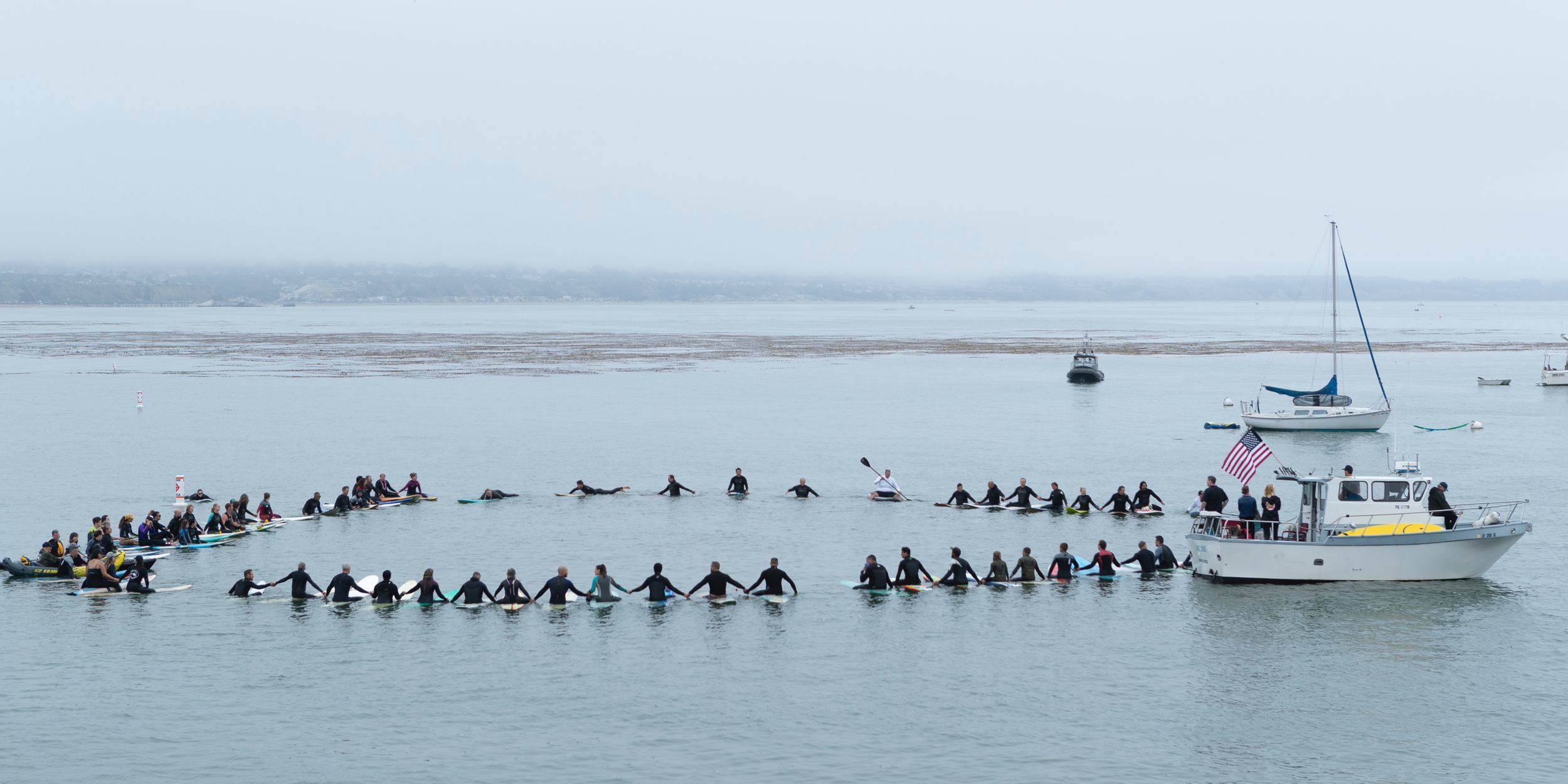 Memorial Day Marked by Wreaths, Speeches - and a Mass Surf Paying Homage to Fallen Warriors