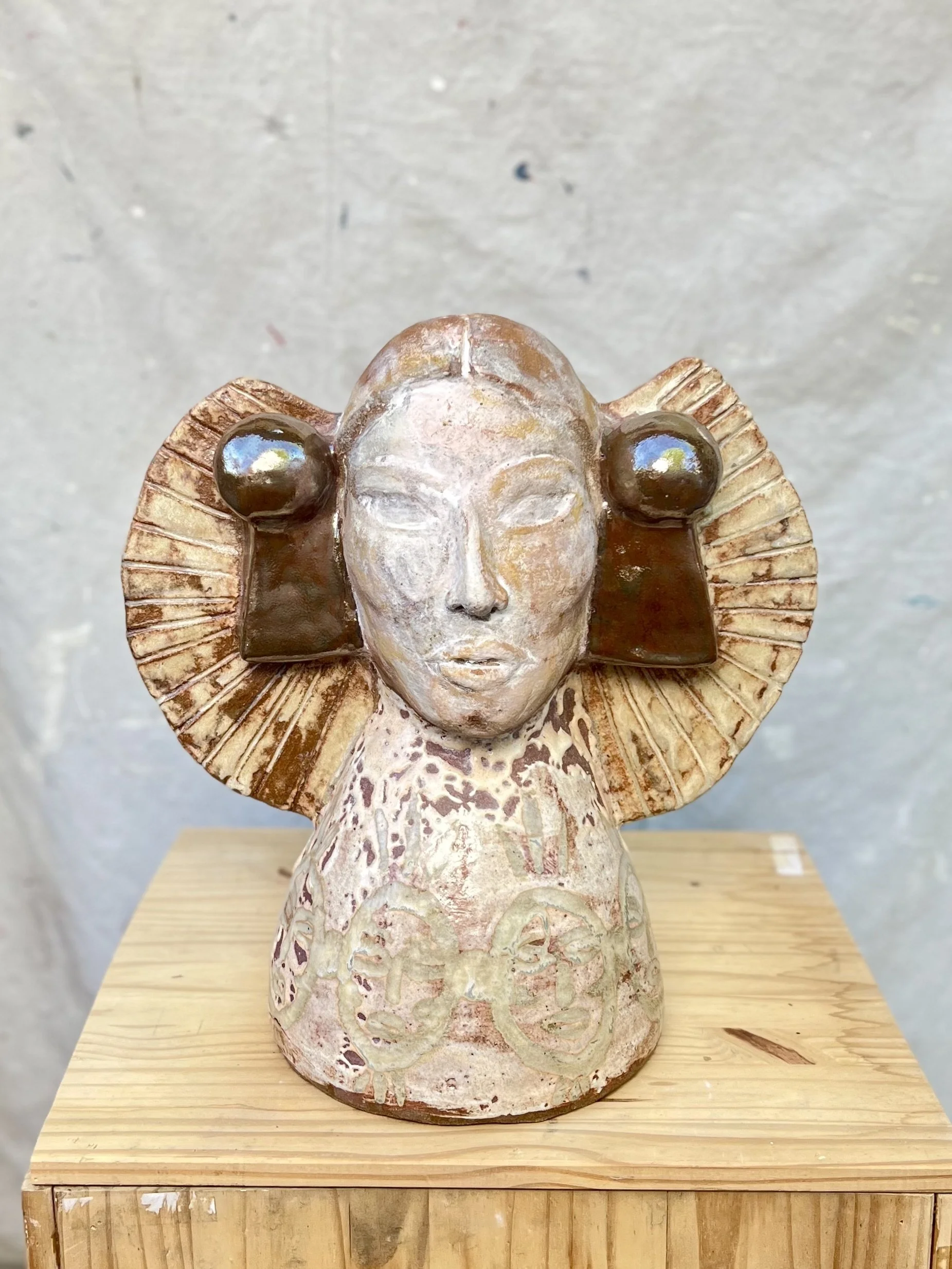 Radiant Bust. 19" x 18" Slipped and glazed stoneware