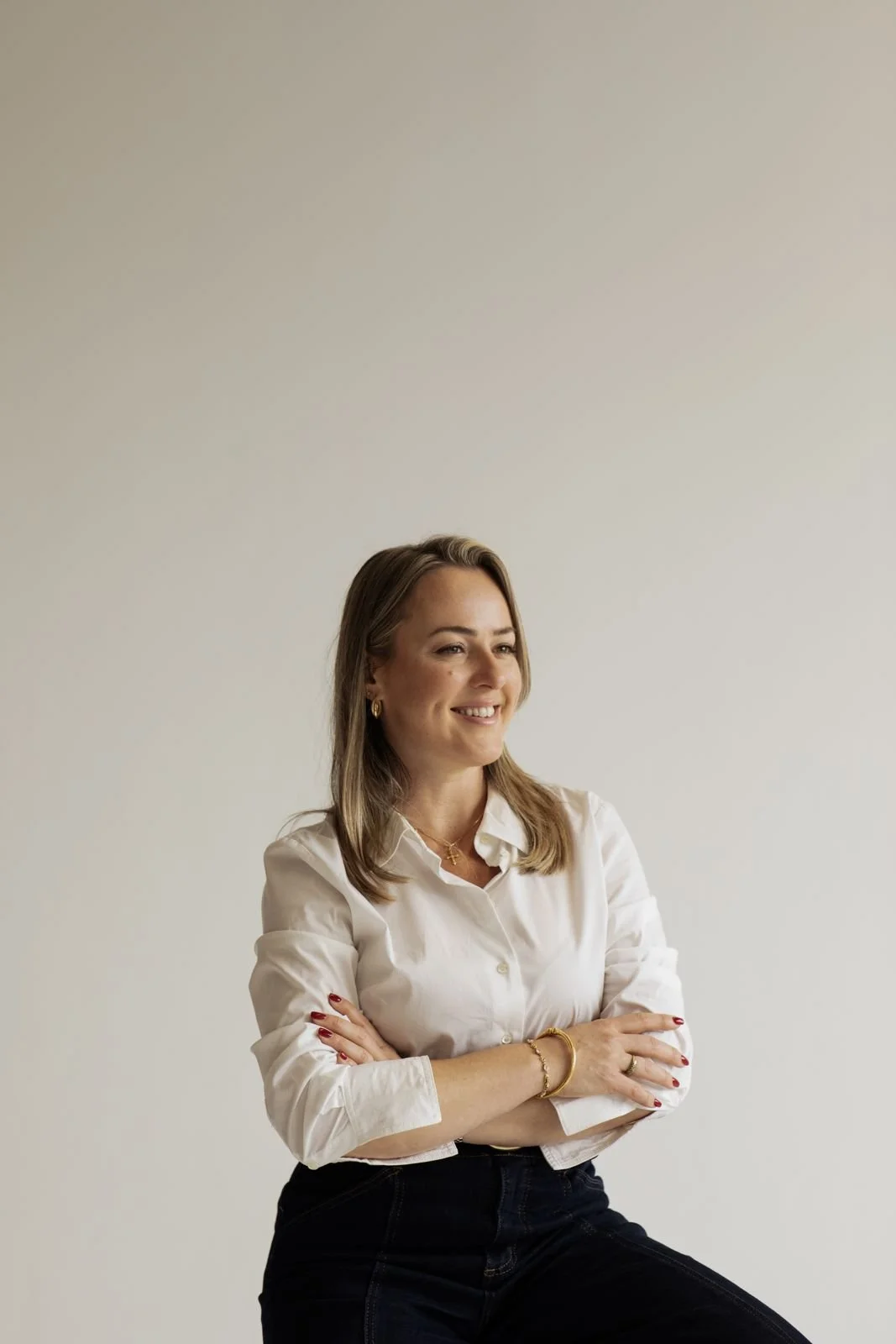 Debora Lengler smiling in a white shirt