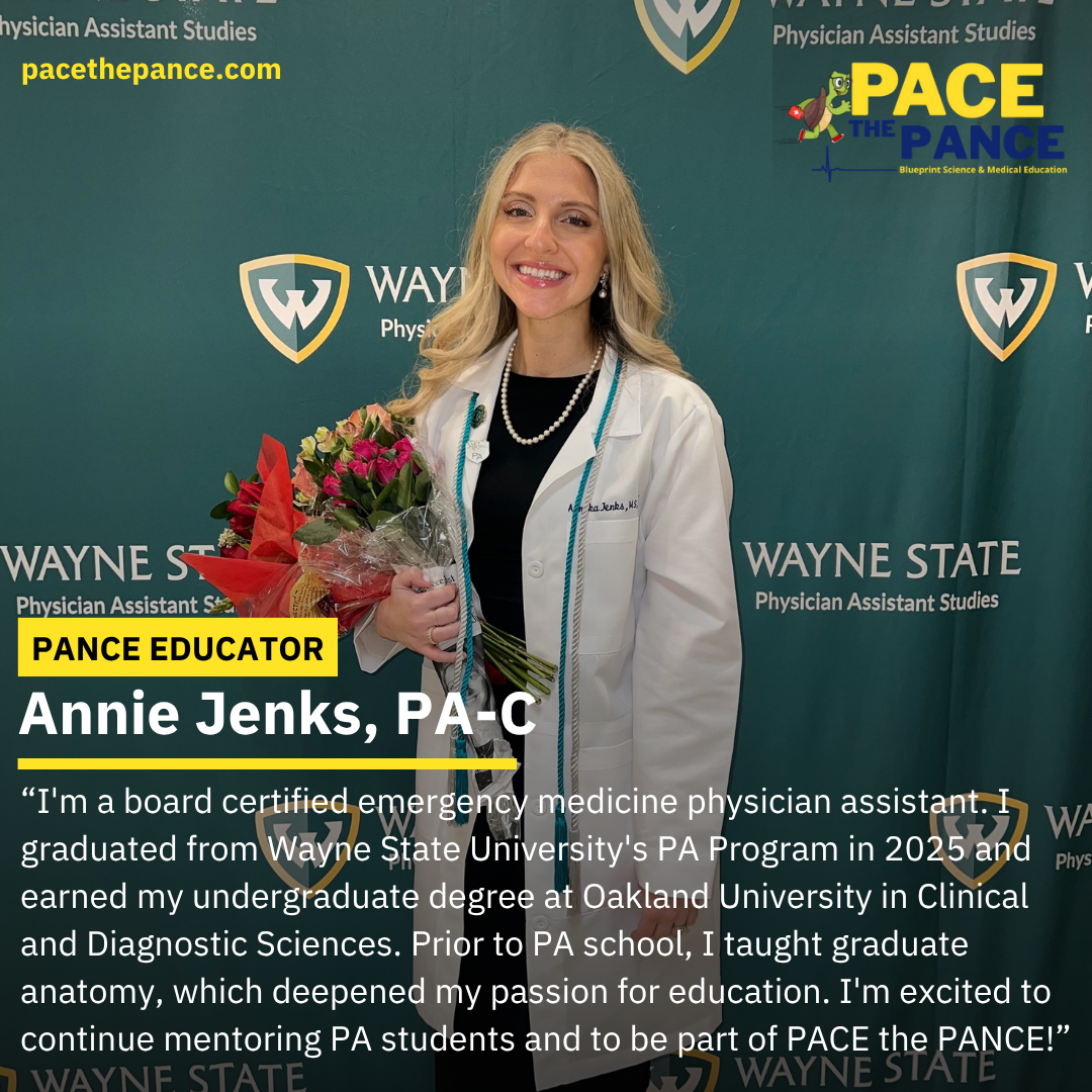 A woman with blonde hair holding a bouquet of flowers, smiling, in front of a green Wayne State University backdrop with logos and text. She is wearing a white coat and a pearl necklace.