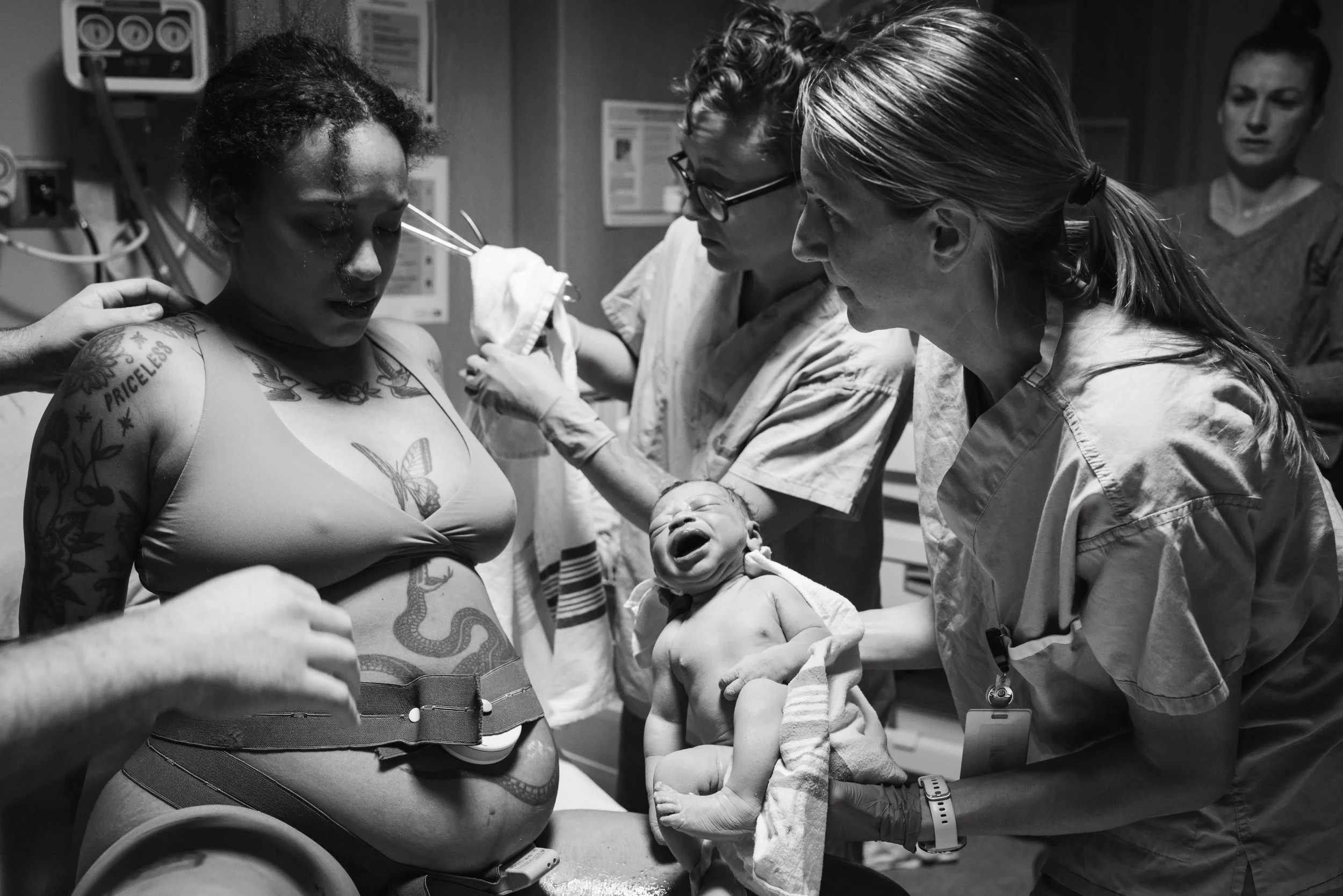 Birthing parent taking a sigh of relief immediately after their baby is born at Kootenay Lake Hospital birth documented by The Birth Laine