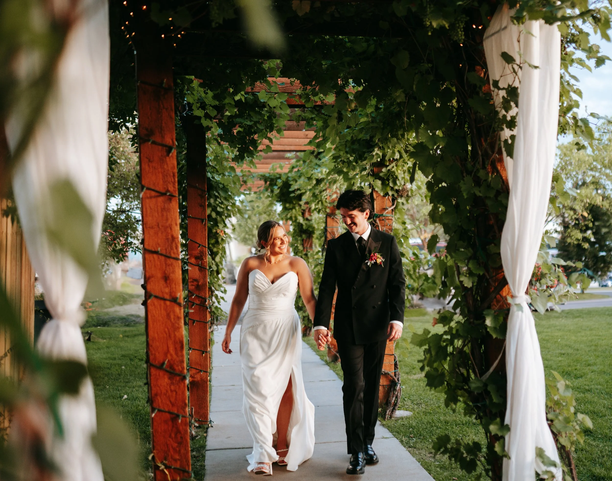 Laurie’s customers, Fernando and Kate embracing by the lake on their wedding day.