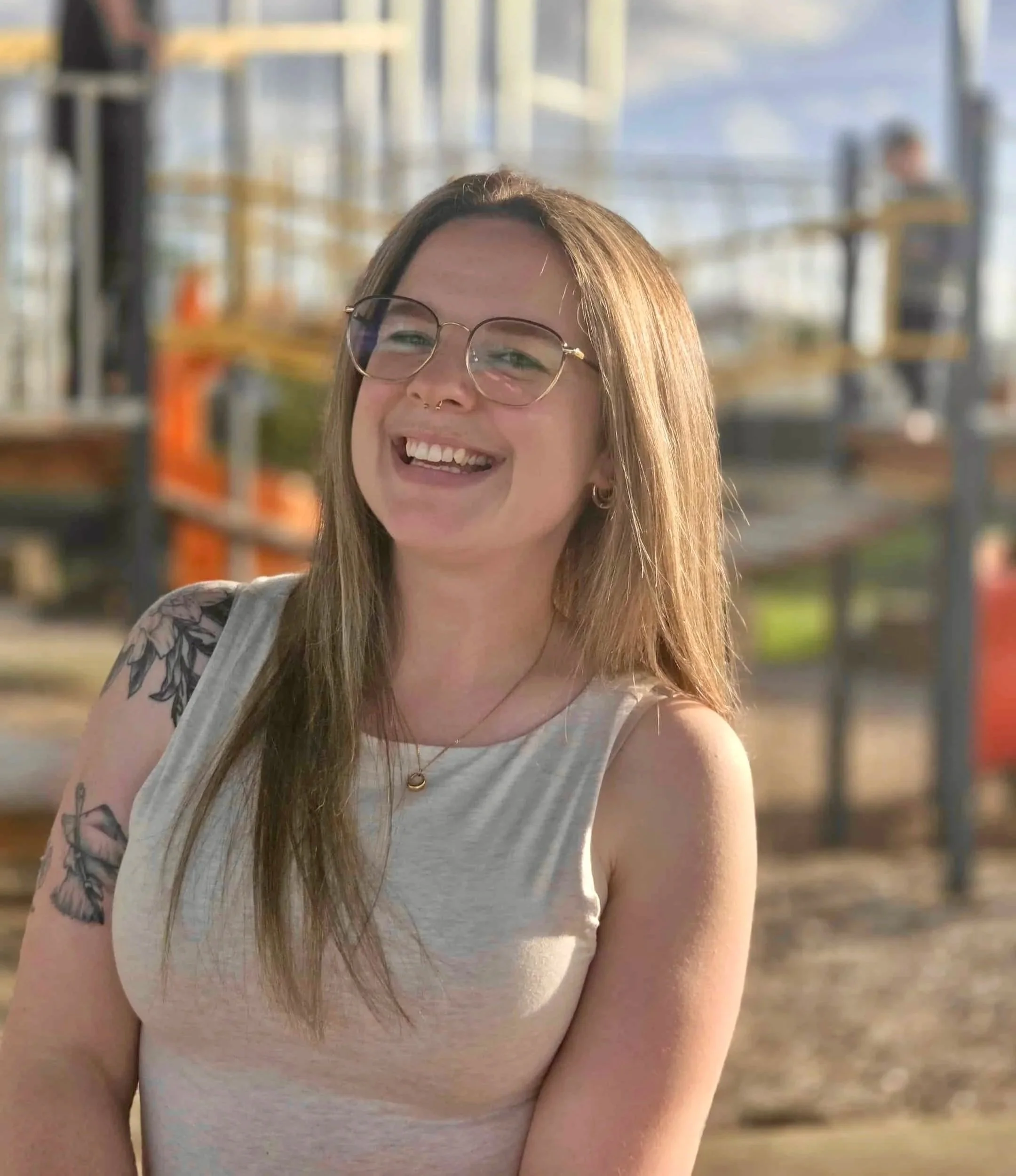 Cass Thornton hanging out in a sunny park, living her best life