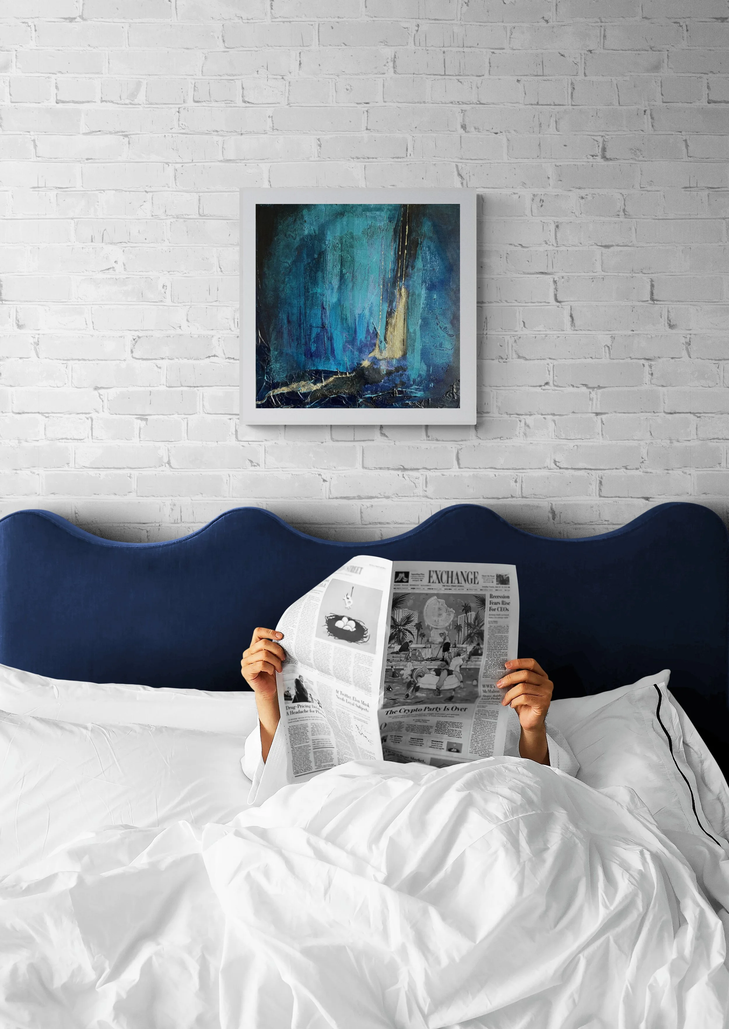 Abstract mixed media collage artwork by Virginie Hotte displayed in a modern bedroom interior on a white brick wall above a bed