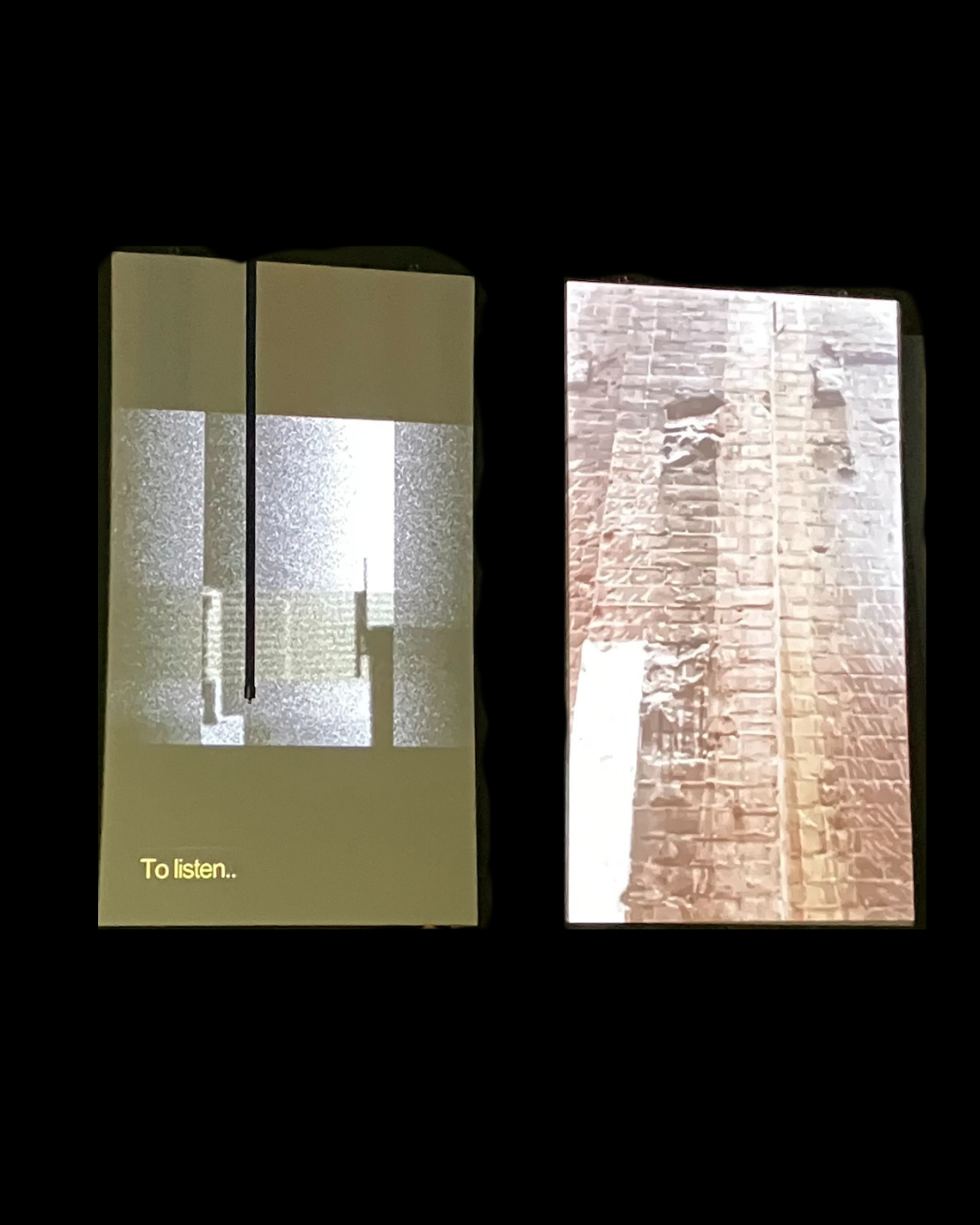 Two digital screens displaying images of brick walls, with some text "To listen..." on the left screen.