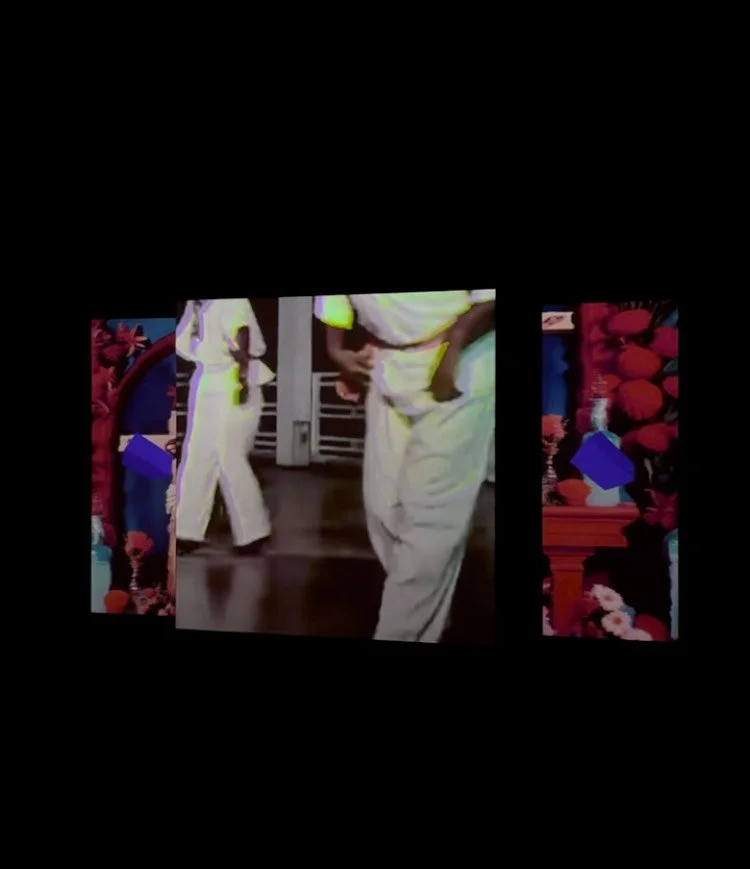 Screen displaying a video of people walking in white uniforms, surrounded by colorful floral patterns and decorative elements.