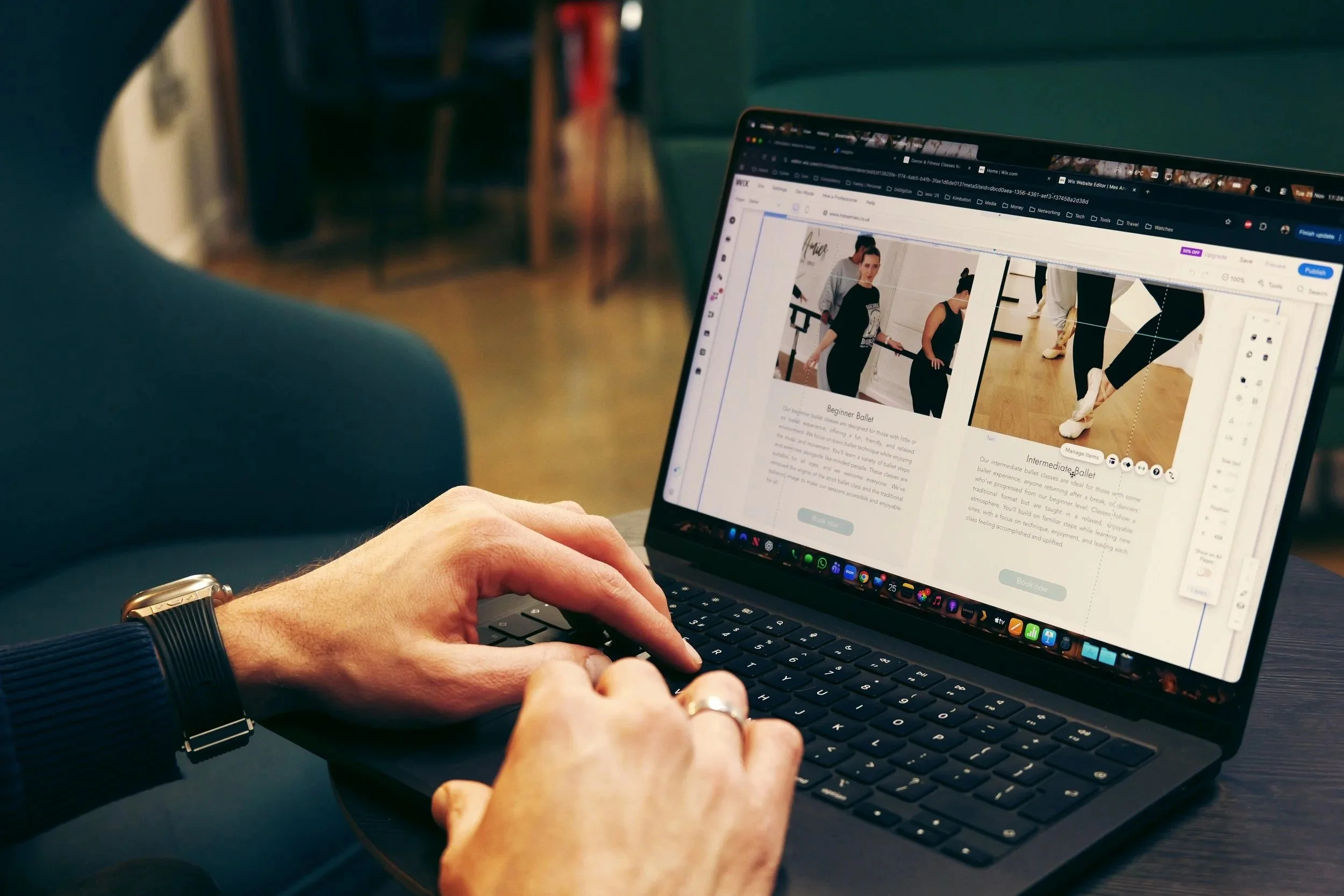 Person using a laptop at a desk, viewing a webpage about ballet classes with images of dancers and descriptions for beginner and intermediate ballet.