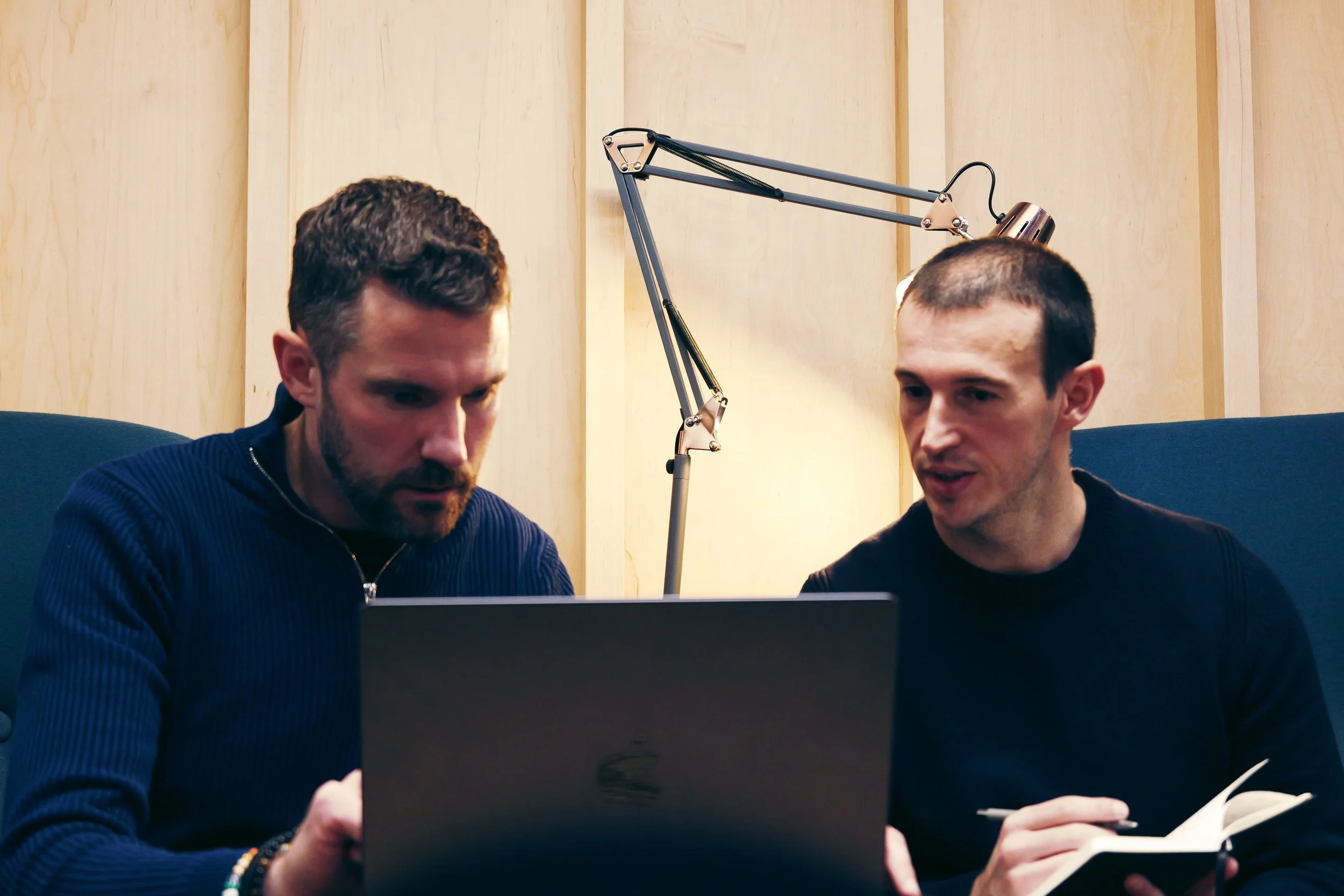 Computer screen displaying lines of PHP and HTML code with syntax highlighting in various colors.