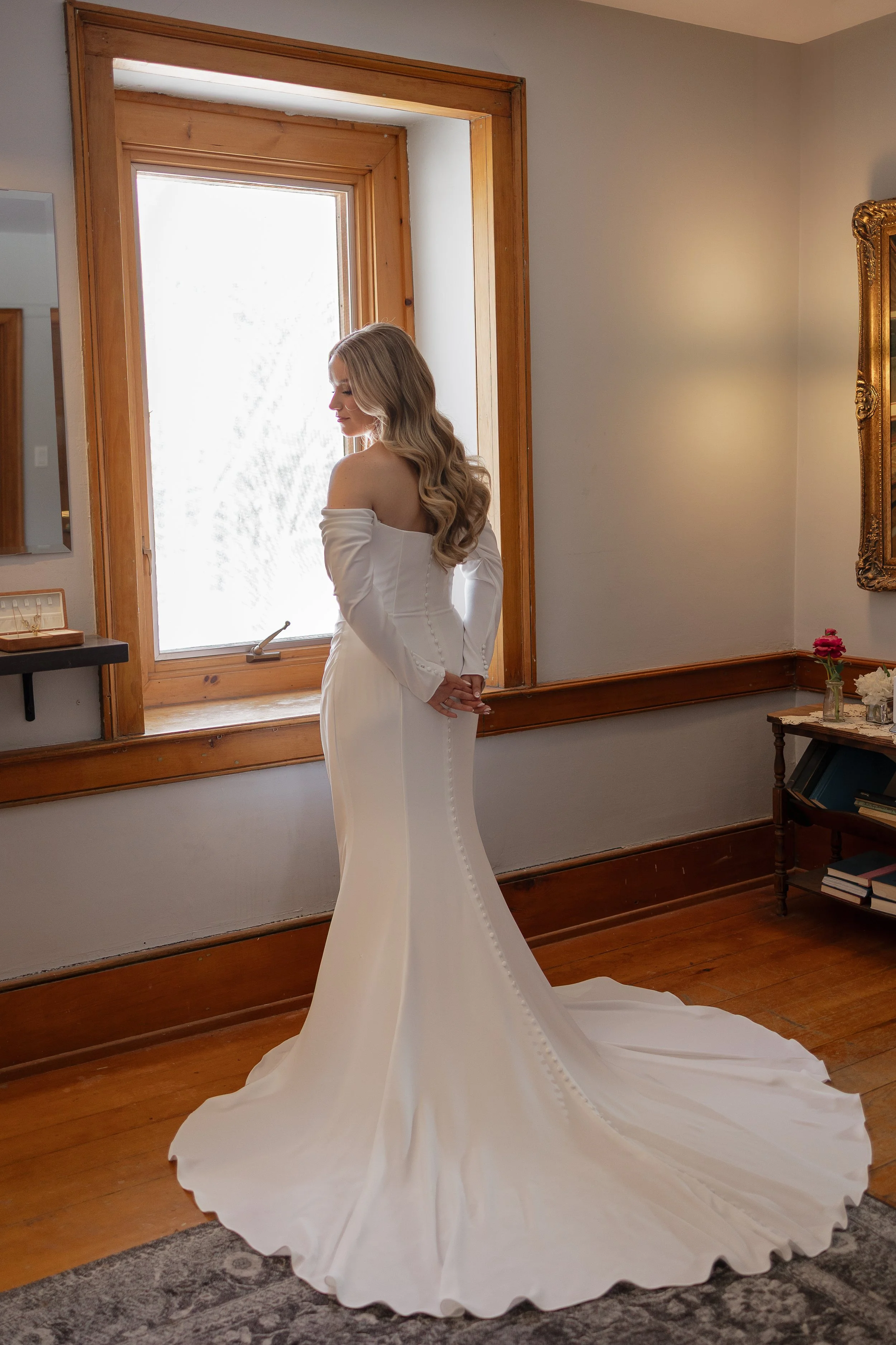 Bride looking out the window, Roseville Estate wedding, Ontario wedding photography by James and Alyson Photography