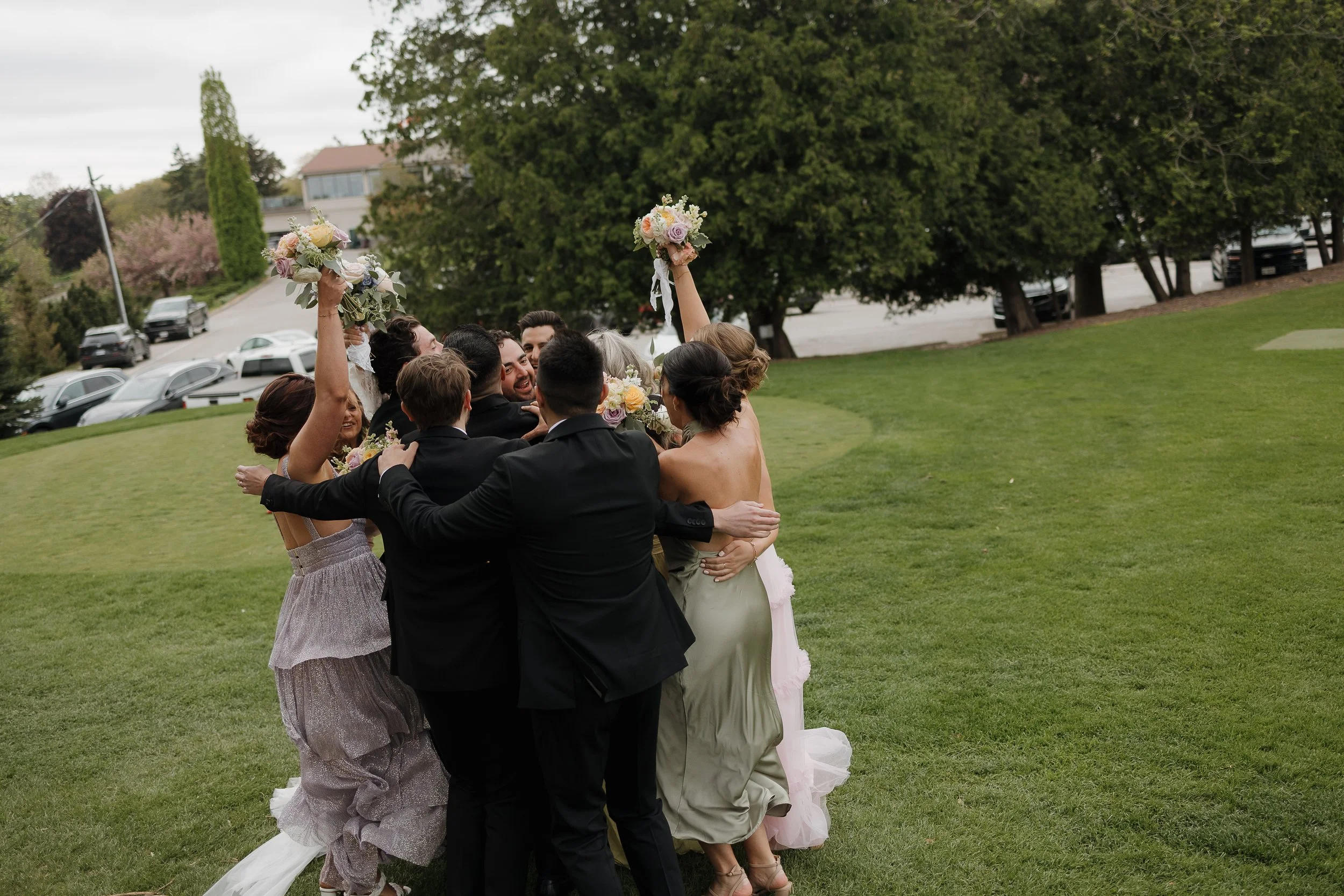 wedding party celebrating the bride and groom after ceremony at an ontario wedding