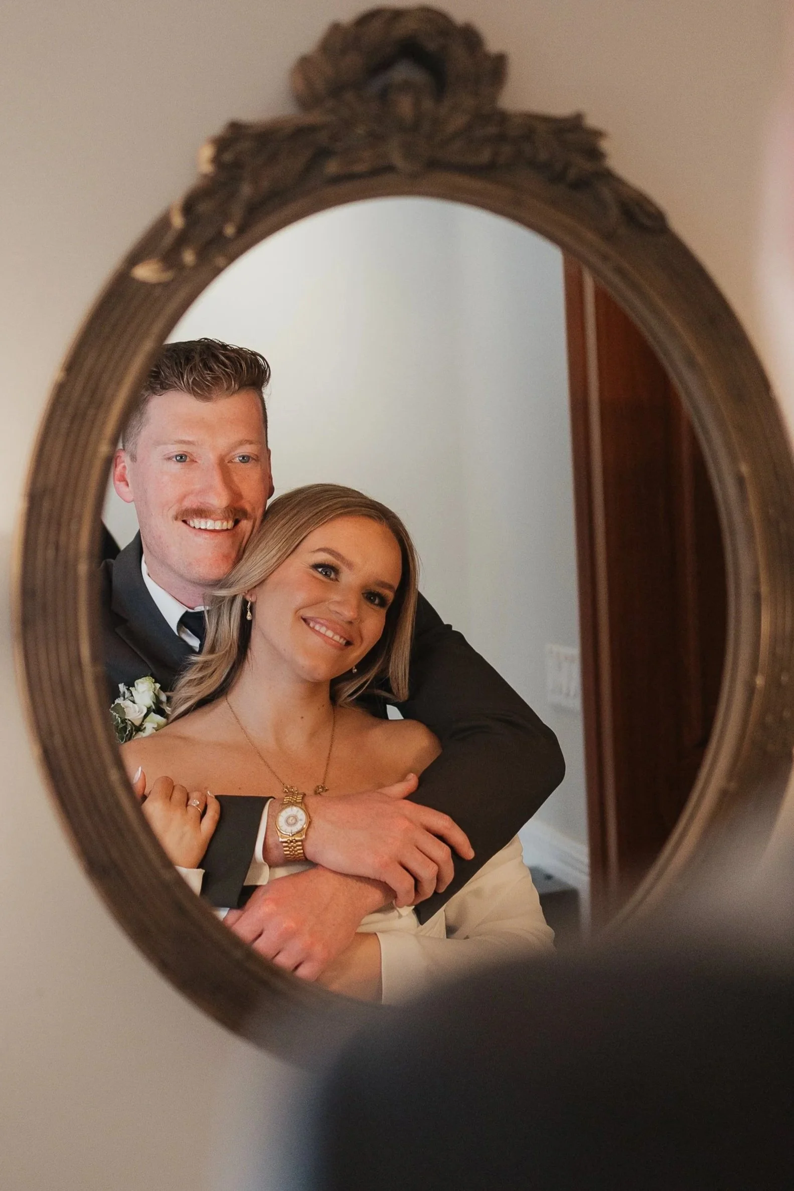 Bride and groom getting ready for the ceremony together at Roseville Estate in Kitchener Ontario, photographed by James and Alyson Photo