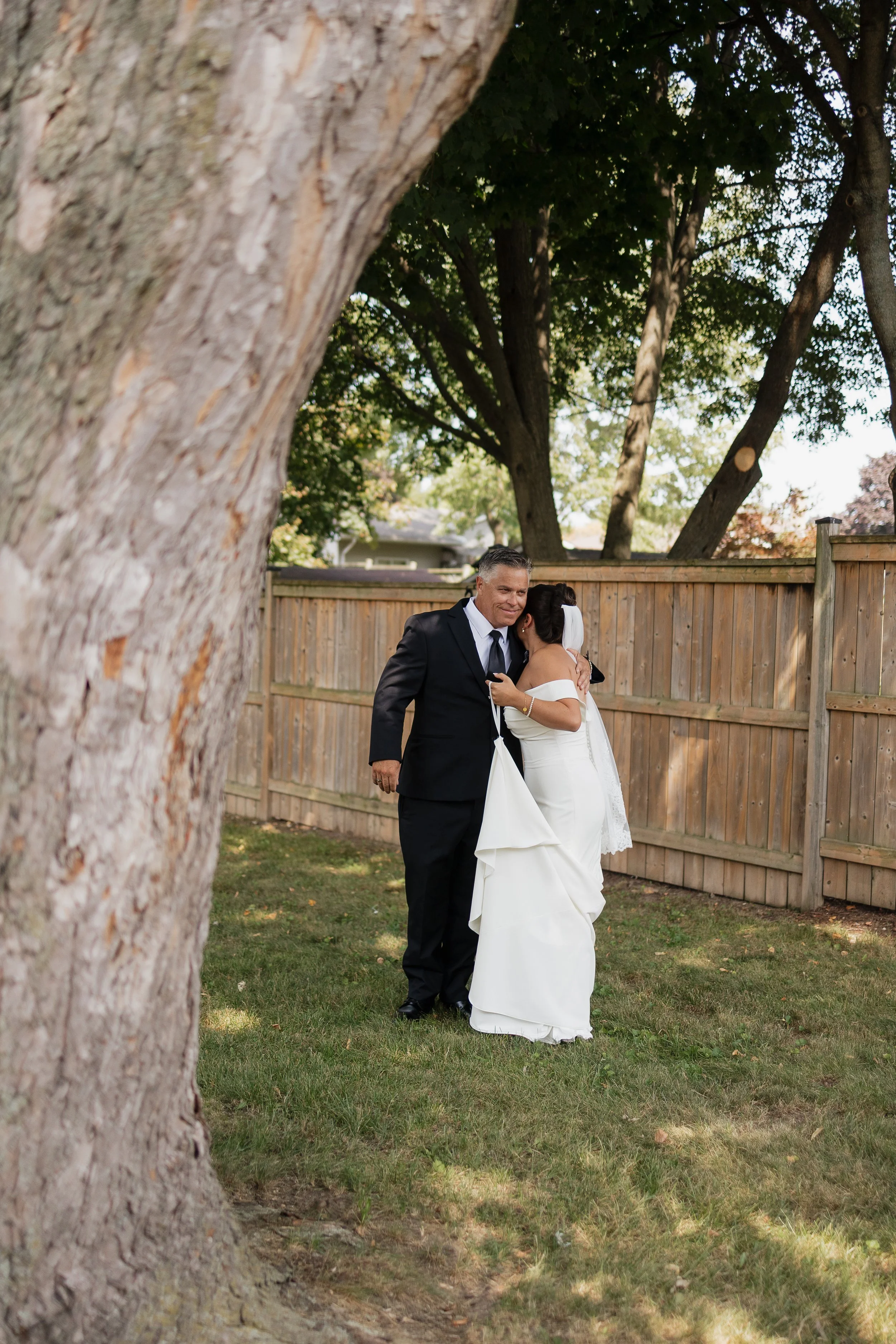 bride doing a first look with dad at home, Ontario wedding photography by James and Alyson Photography
