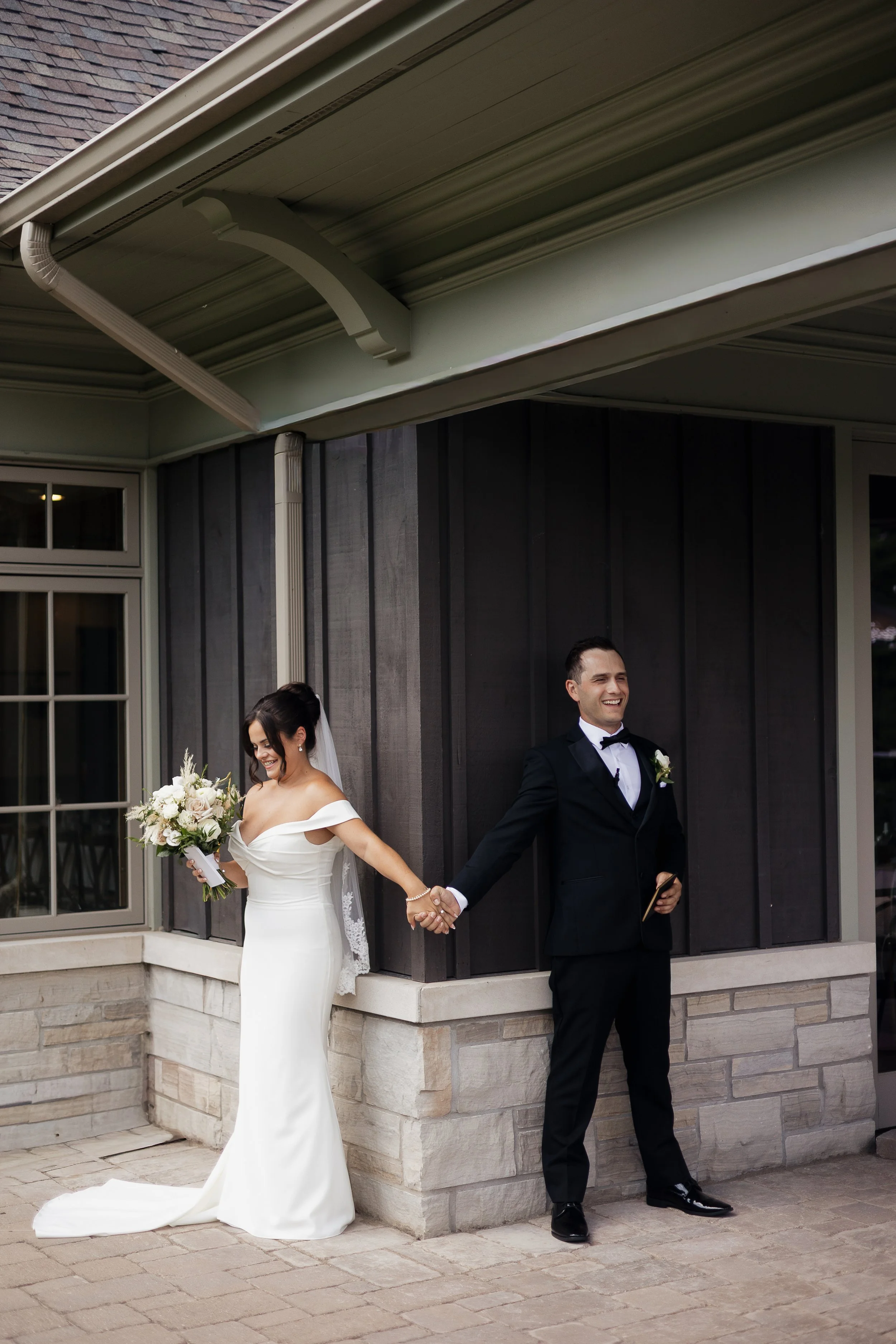 bride and groom doing a first touch before the ceremony, Ontario wedding photography by James and Alyson Photography
