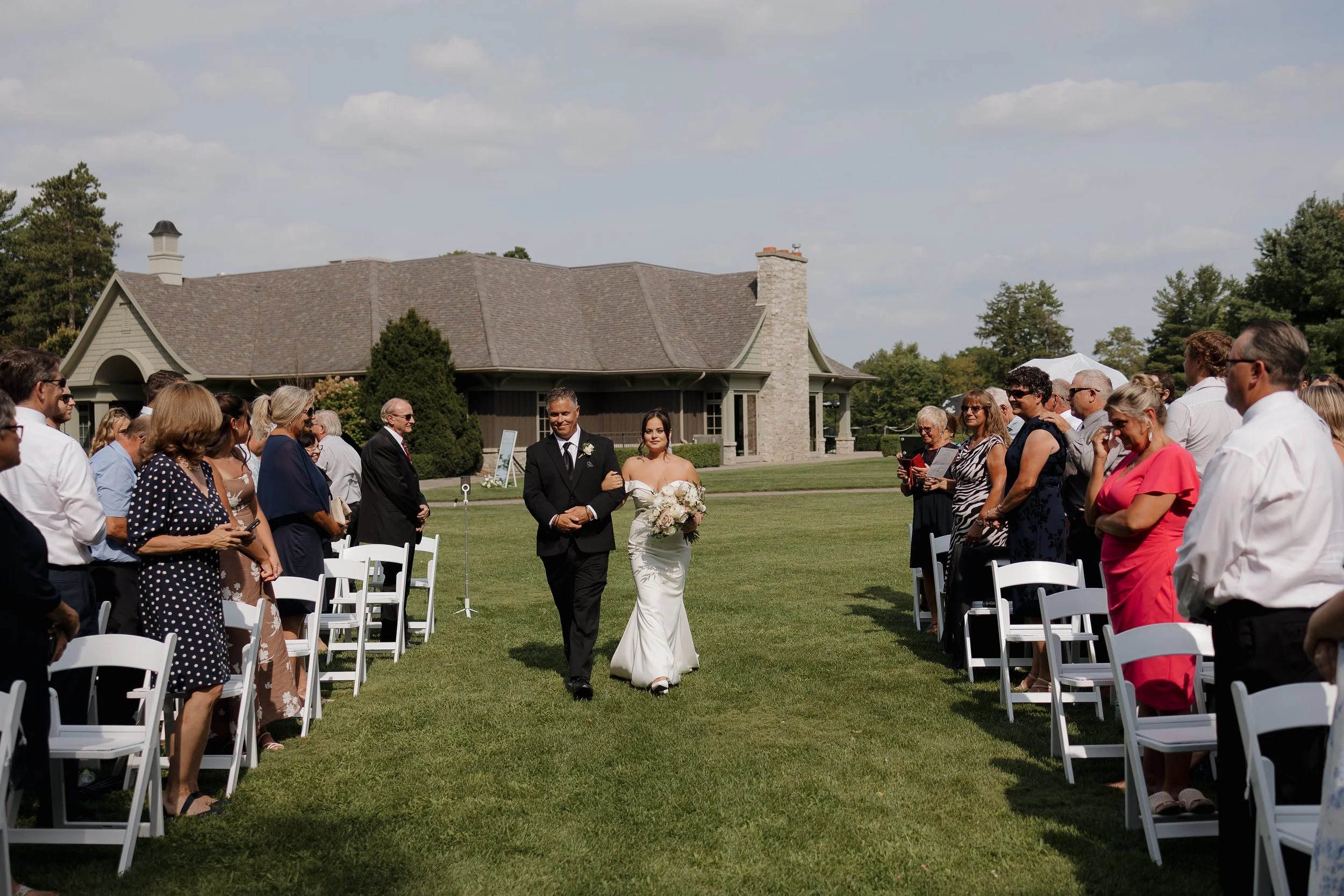 bride walking down the aisle with father, Ontario wedding photography by James and Alyson Photography