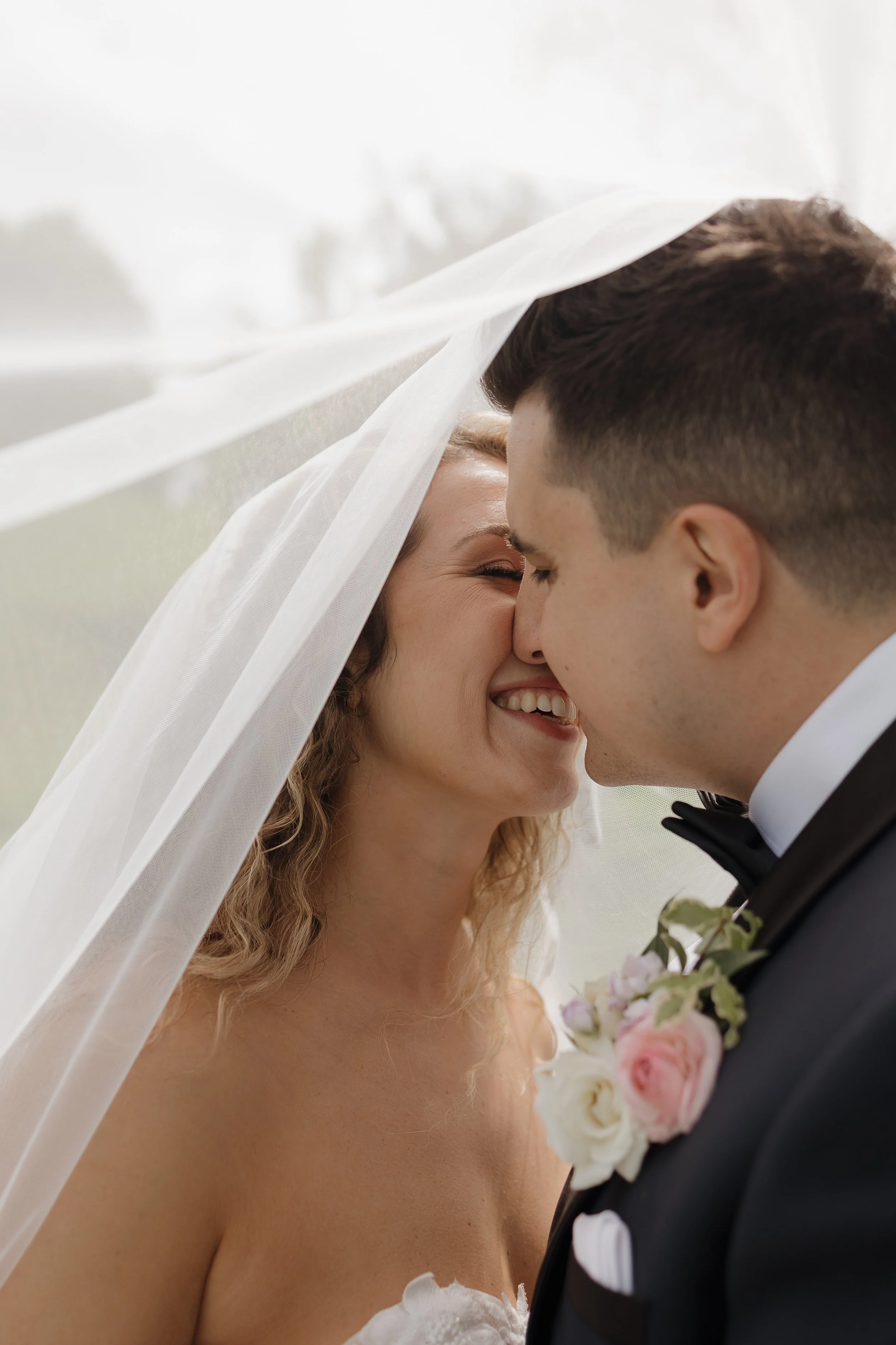 Bride and groom under the veil, Ontario wedding photography by James and Alyson Photography