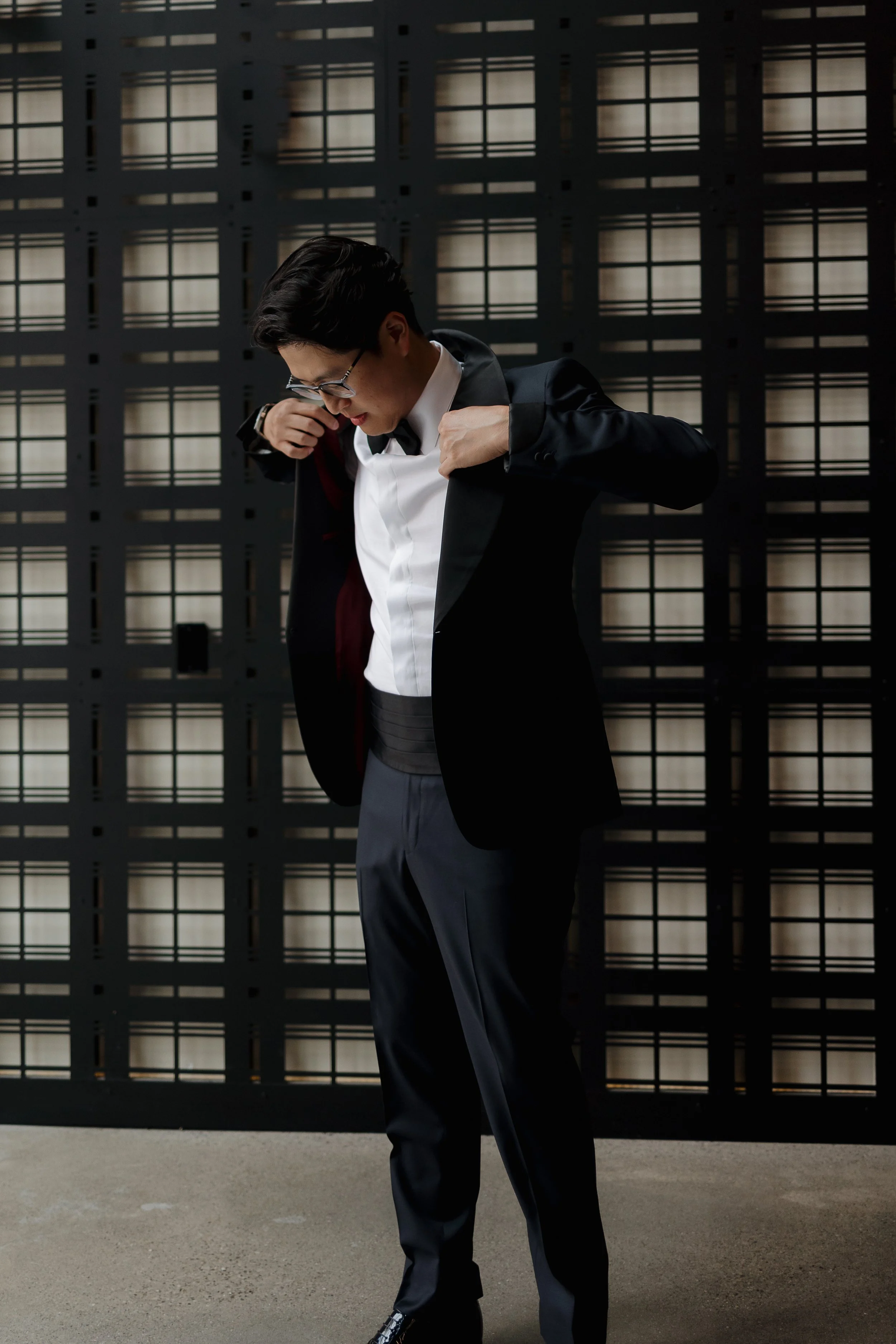 Groom’s final touches before the ceremony, captured by James and Alyson Photography in Cambridge