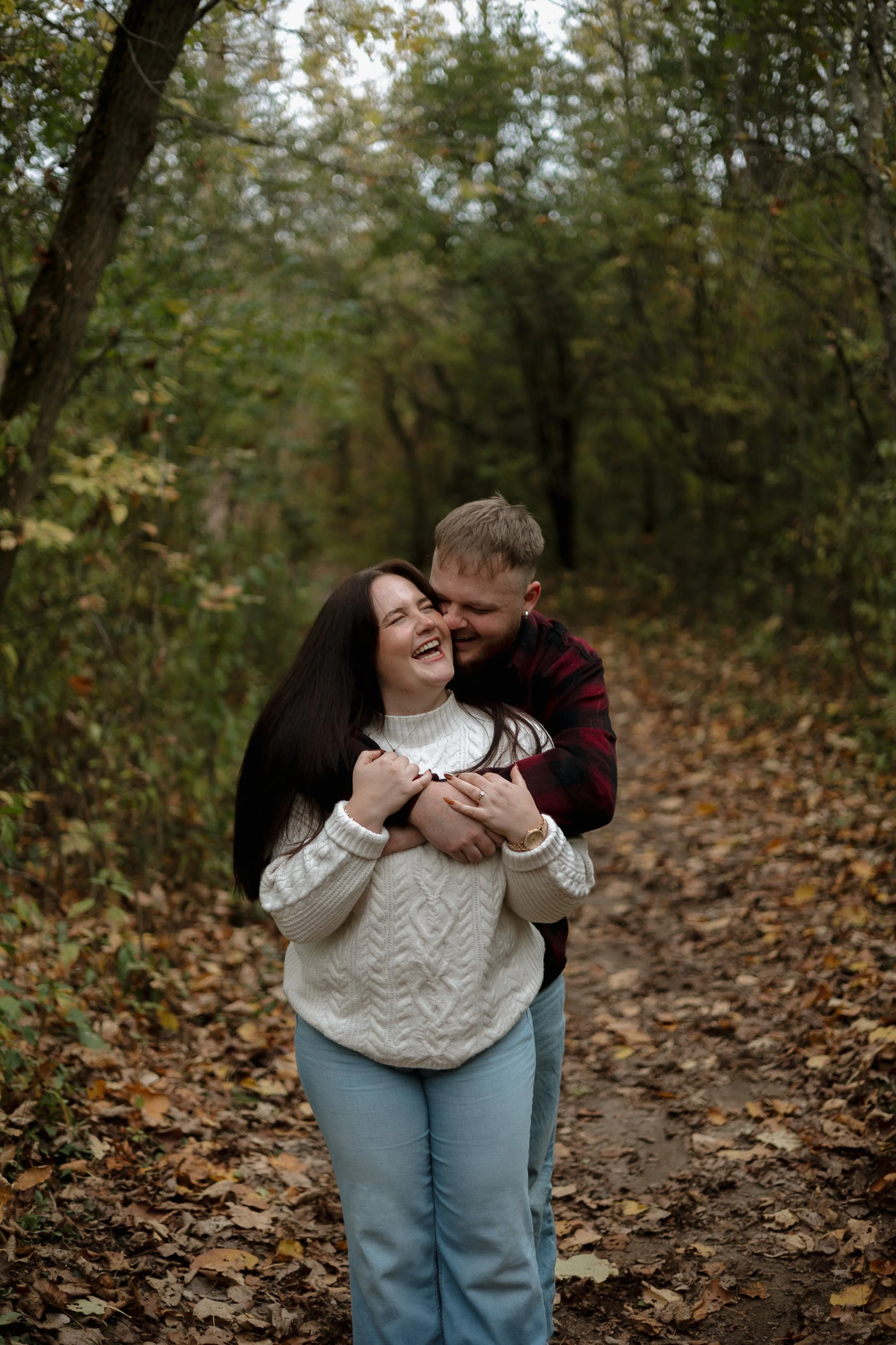 Cozy engagement session at Penman’s Pass Paris Ontario with couple wrapped in fall layers and warm tones