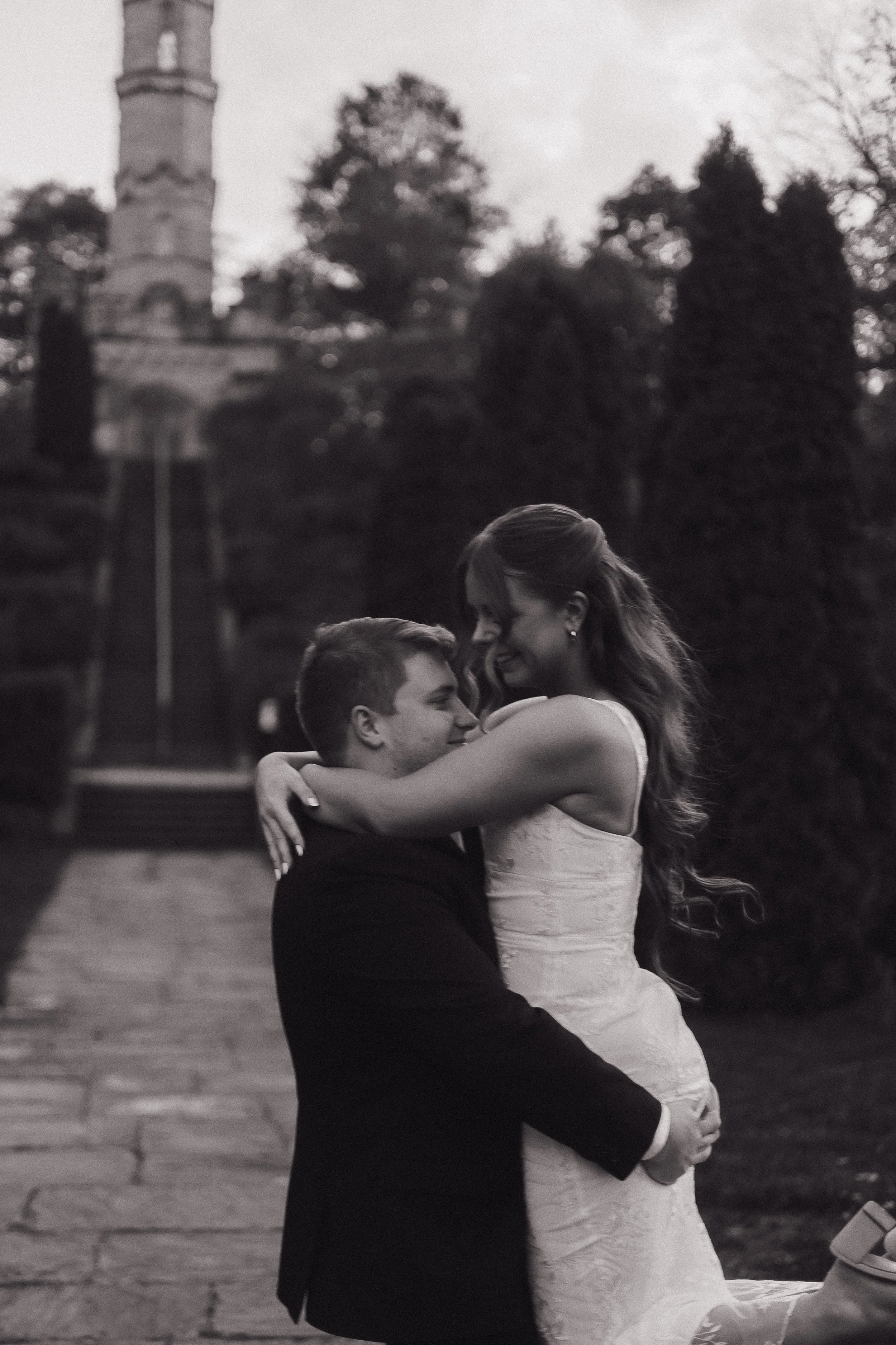 Will lifting Abi for a spin, Ontario wedding photography by James and Alyson Photo