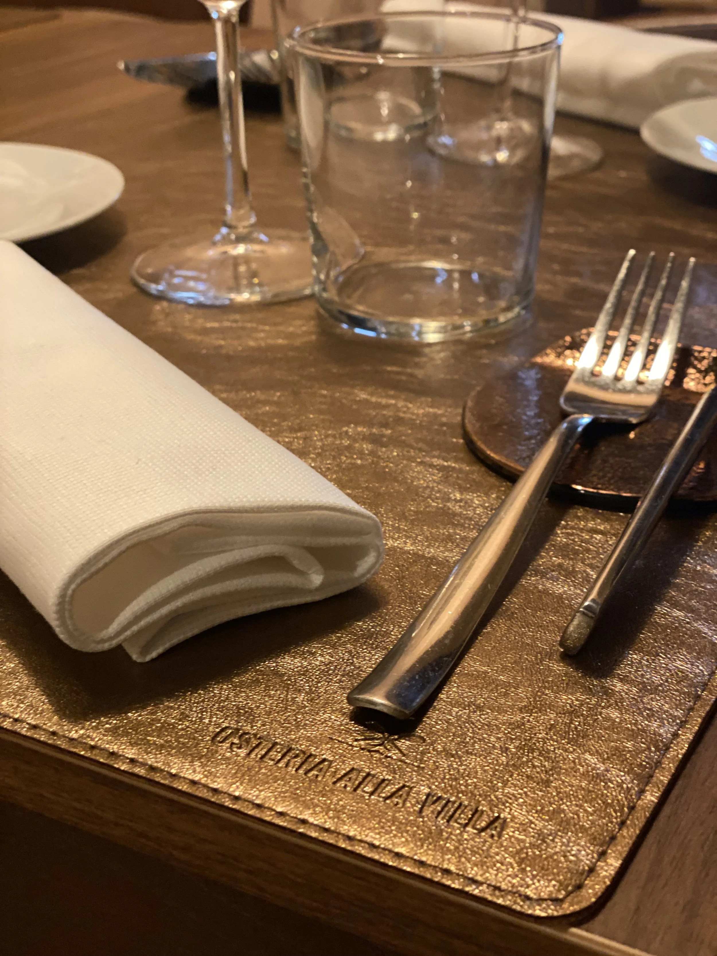 Picture worthy, modern place setting in an authentic, historic restaurant in the heart of Tuscany. Osteria Alla Villa offers a favorite dining experience with excellent food paired with the perfect Italian wines.