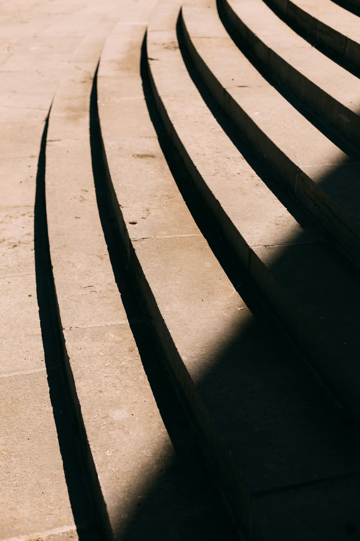Concrete stairs with shadows cast on them.