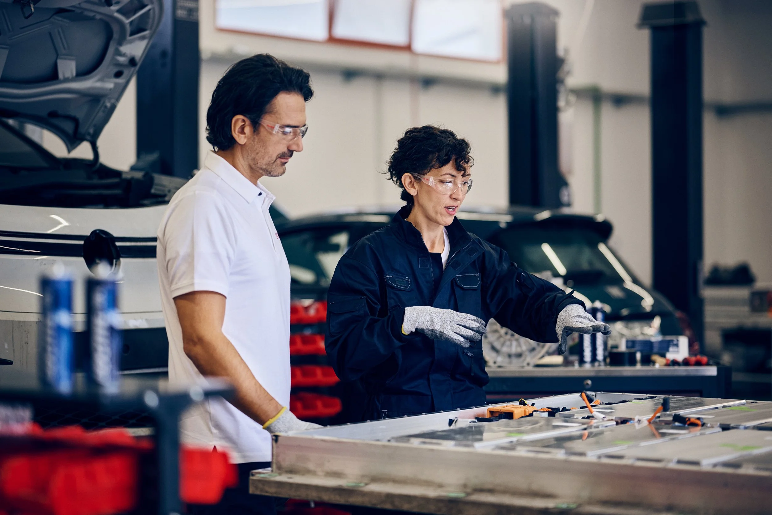 Technicians working on electric vehicle battery