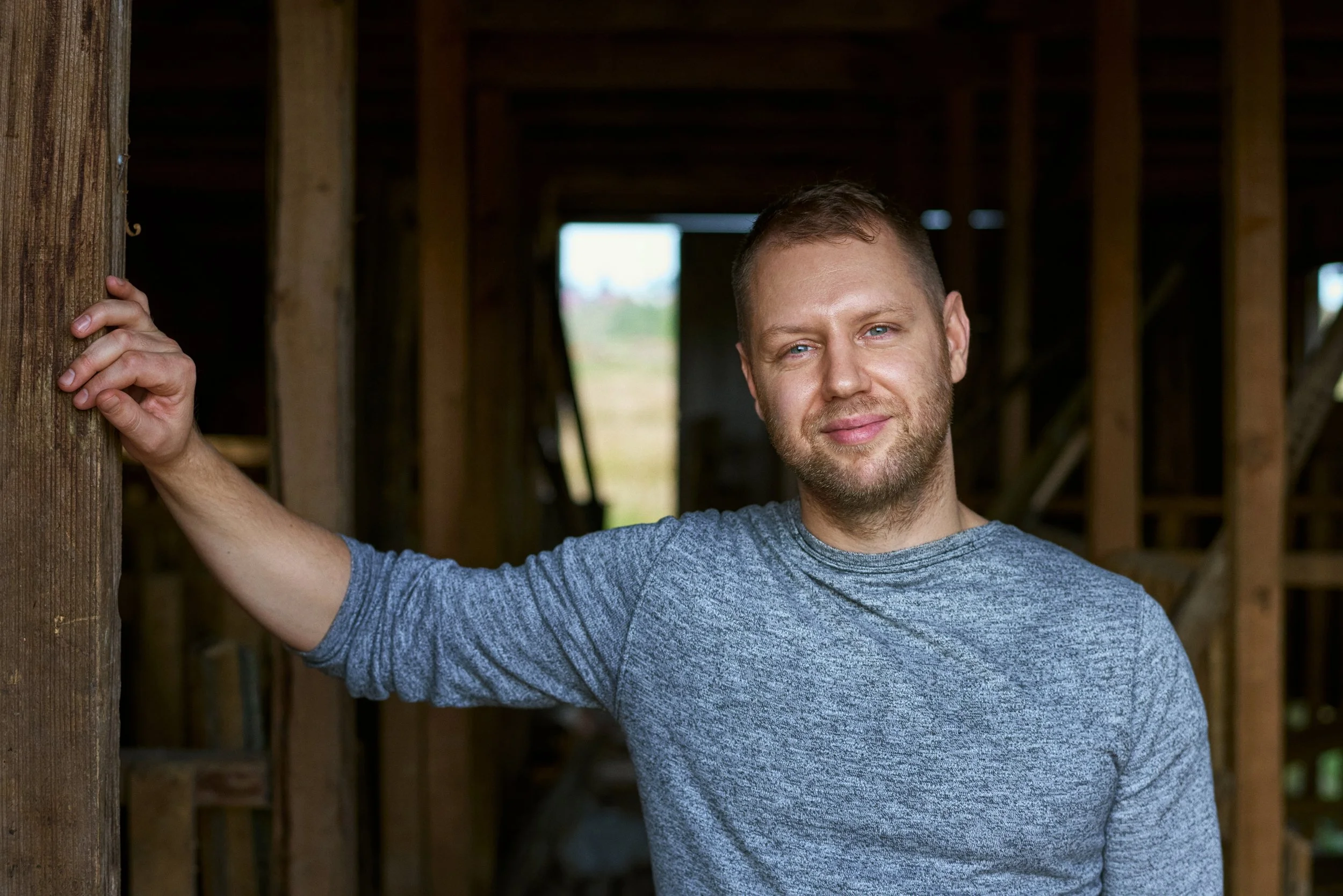 Portrait of man standing in workshop  relaxed posture