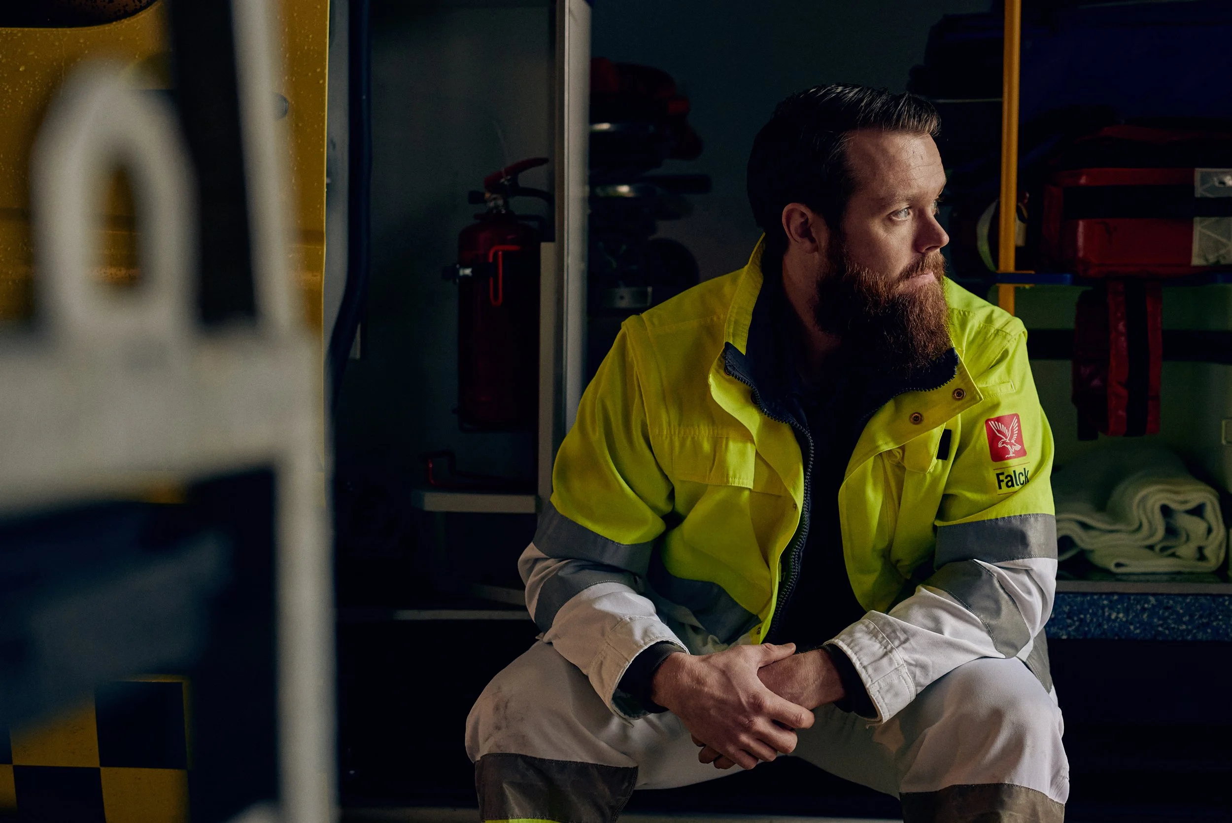 Emergency responder resting inside station, quiet moment between operations