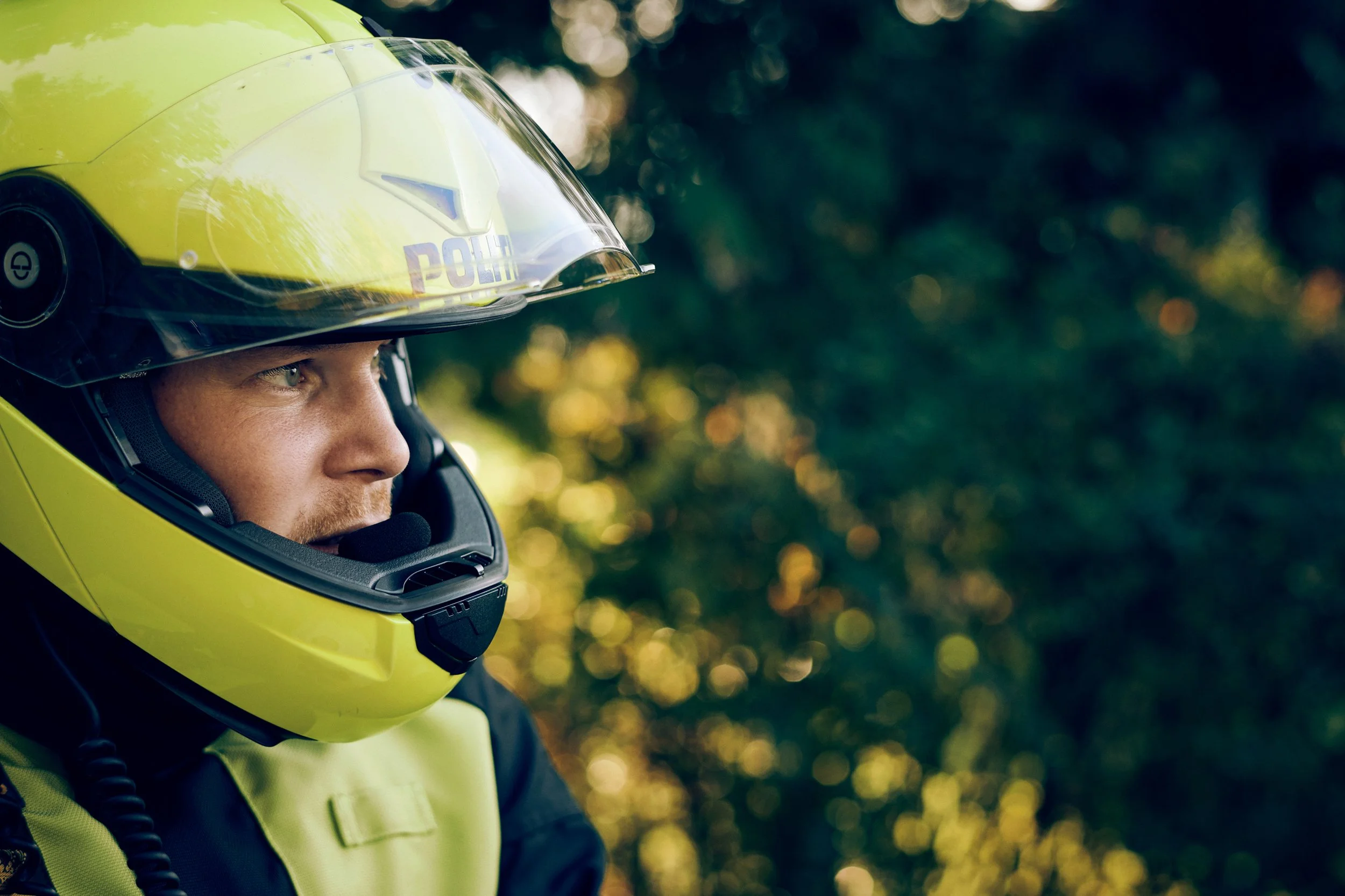 Close-up of police motorcycle officer wearing helmet
