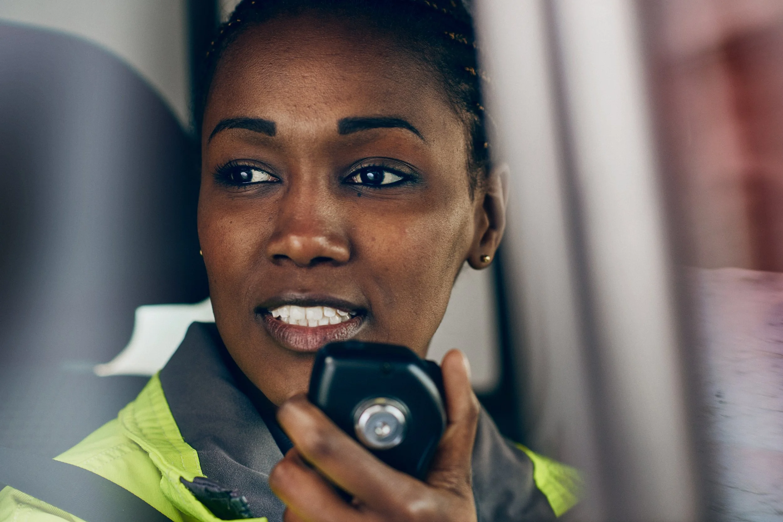 Emergency responder speaking into radio, communication during response situation