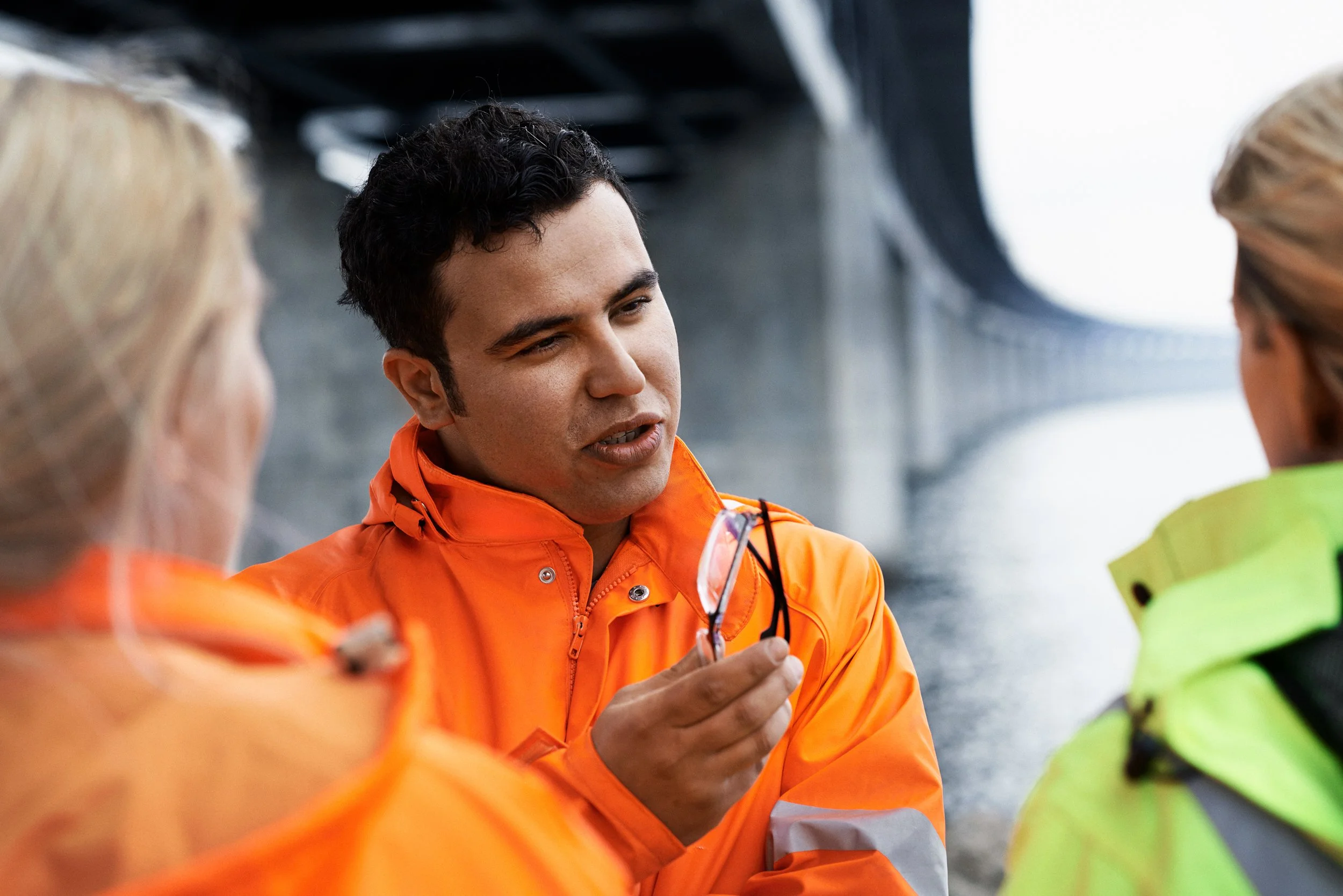 Engineer explaining technical detail to colleagues