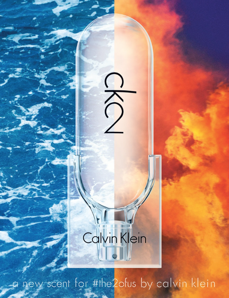 An advertisement for Calvin Klein's CK2 fragrance, featuring a transparent glass perfume bottle split into two halves. The left half shows ocean waves, and the right half shows a fiery sunset sky.