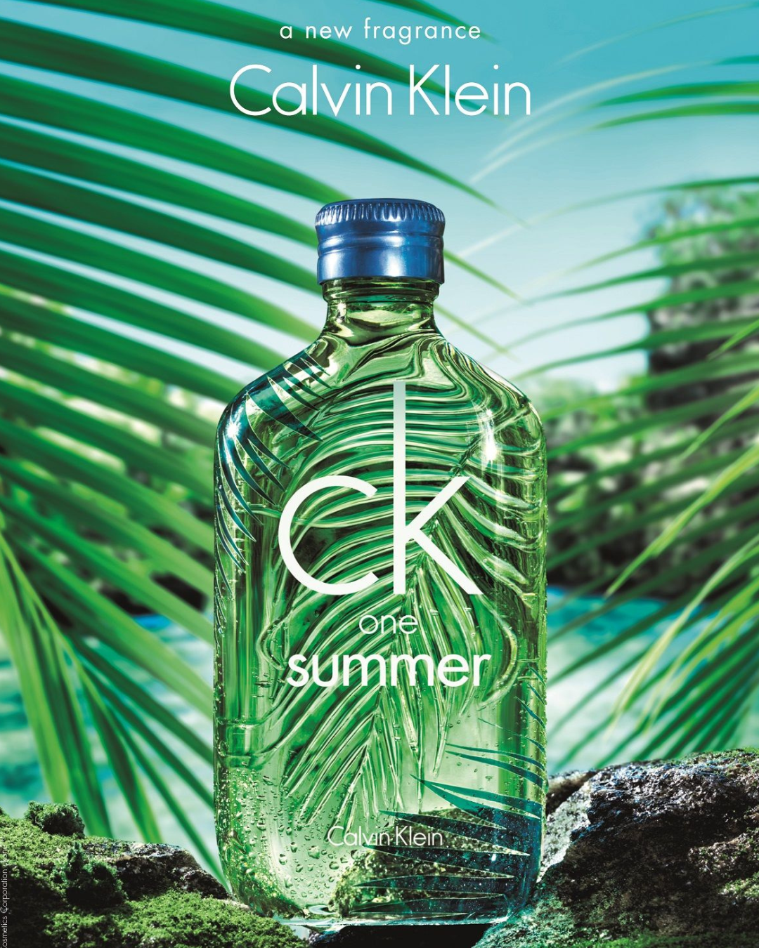 Calvin Klein summer fragrance bottle with palm leaves background.