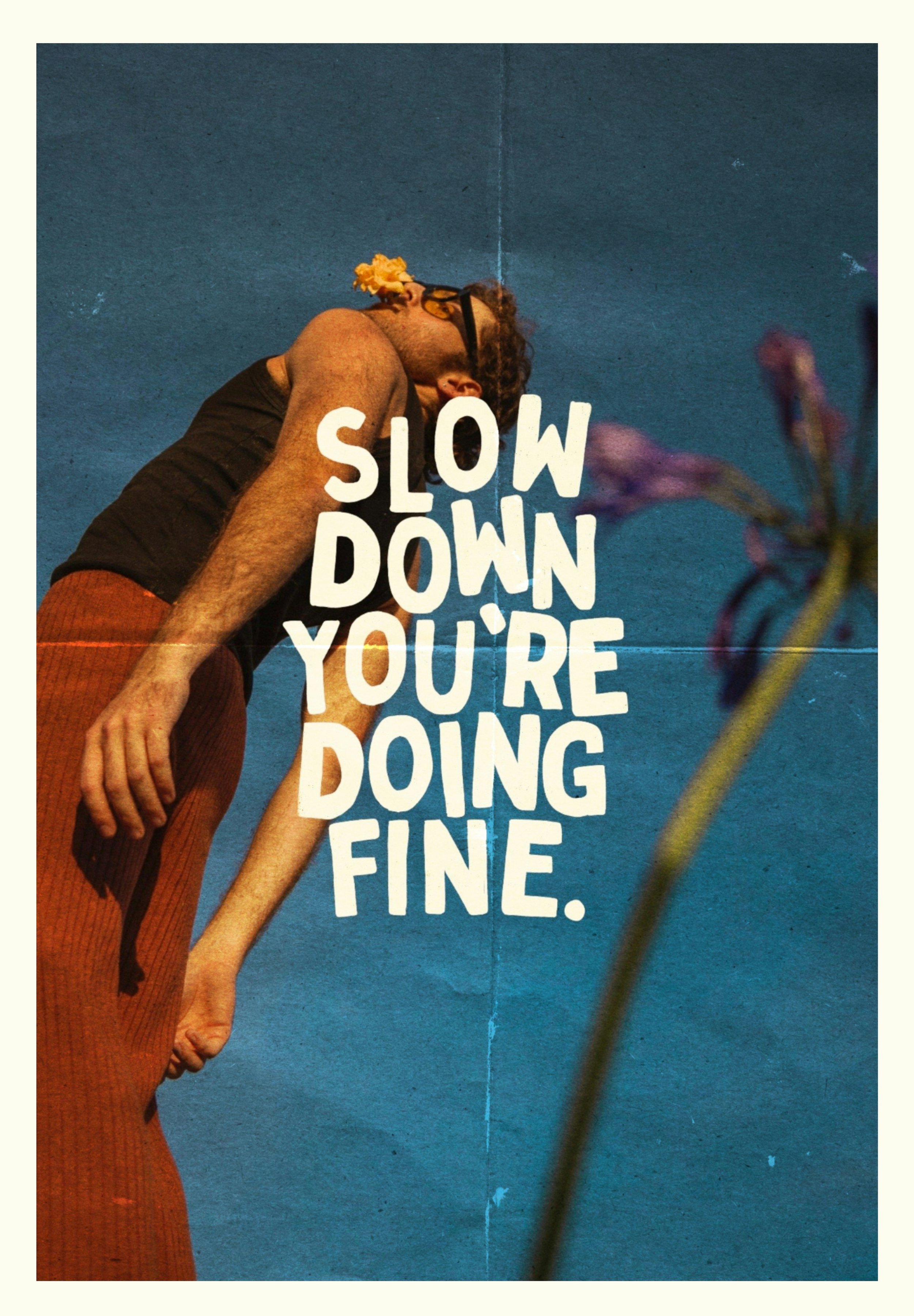 A person leaning to the side against a blue background with a flower in the foreground. Overlaid text reads: "Slow down you're doing fine."
