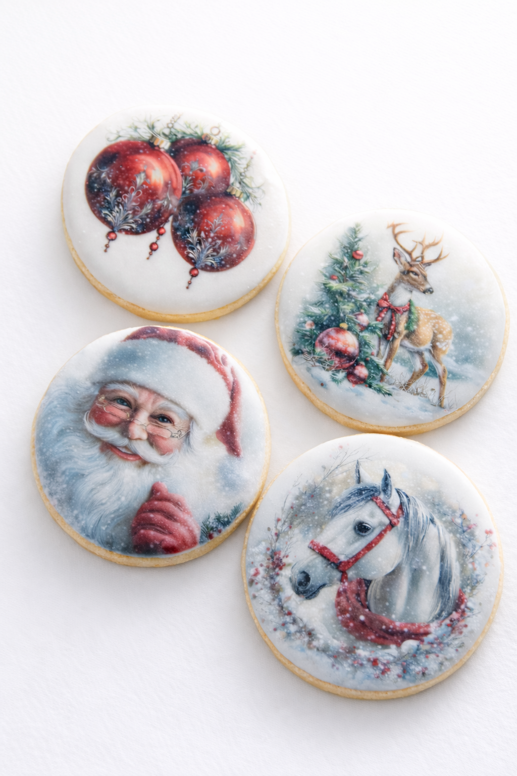 Decorative cookies with Christmas and winter holiday images, including Santa Claus, a reindeer, a horse with a wreath, and Christmas ornaments, arranged on a wooden surface.