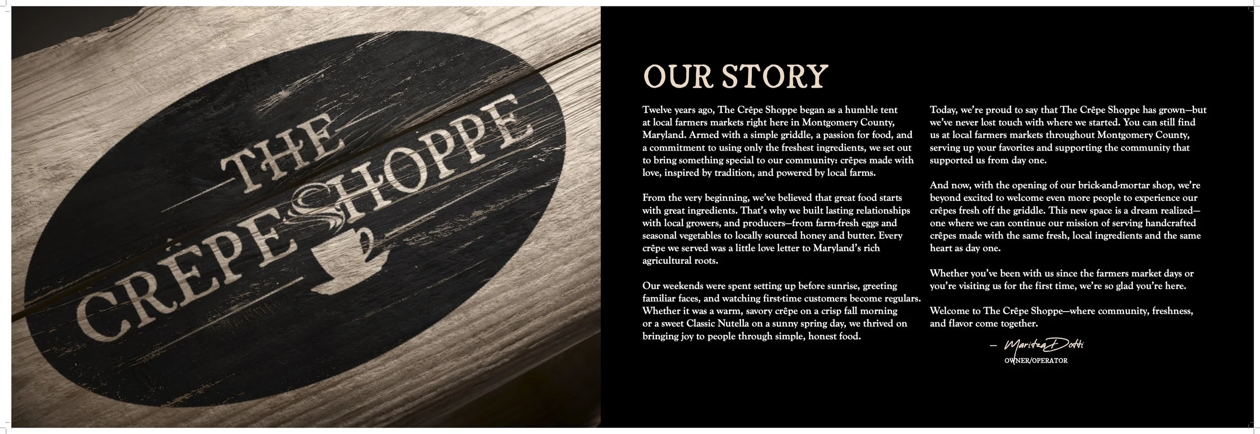 A wooden sign with a black oval background and white text reading "The Crêpe Shoppe."