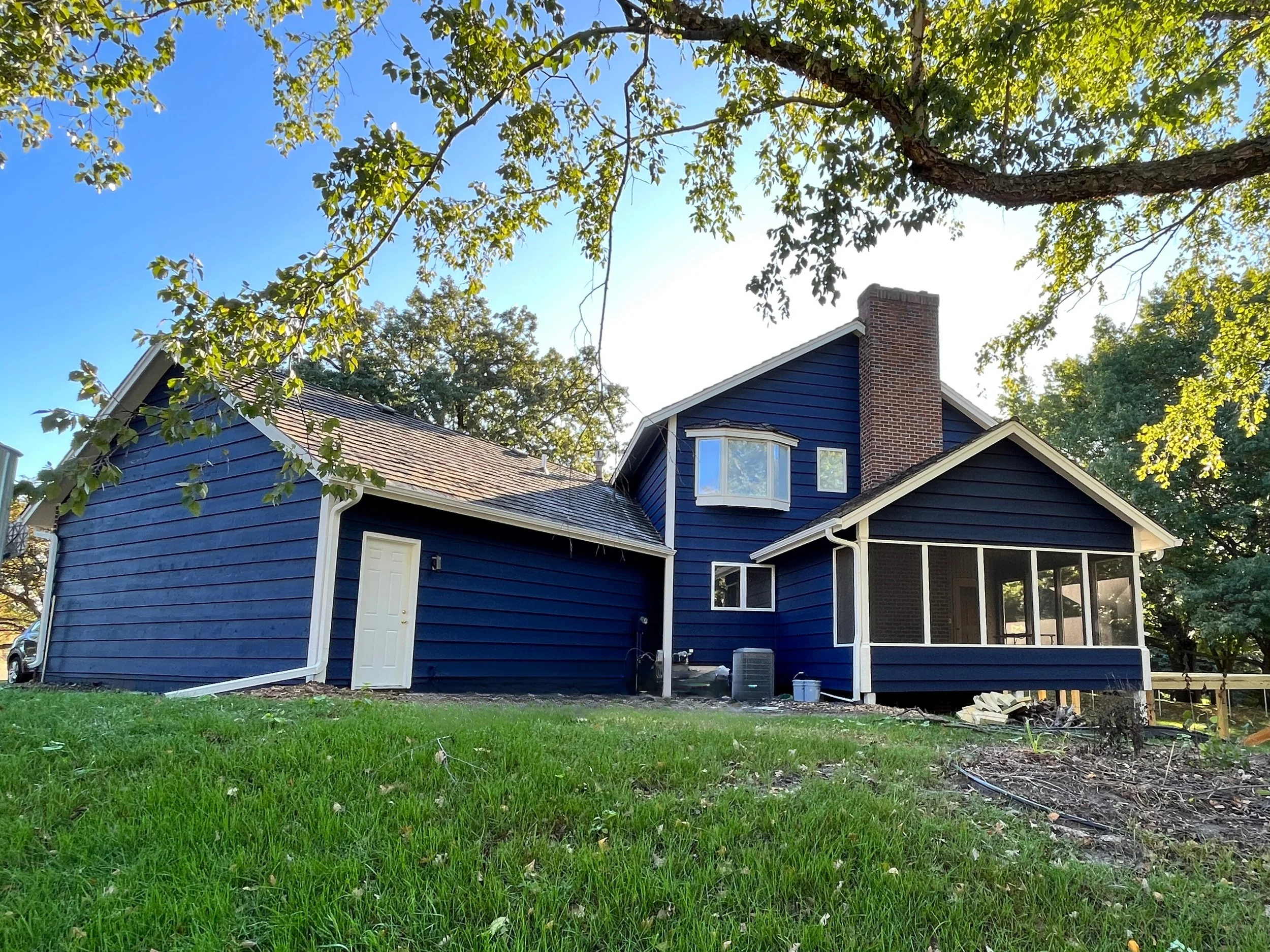 Beautiful blue house after exterior painting completed by The List painting contractors