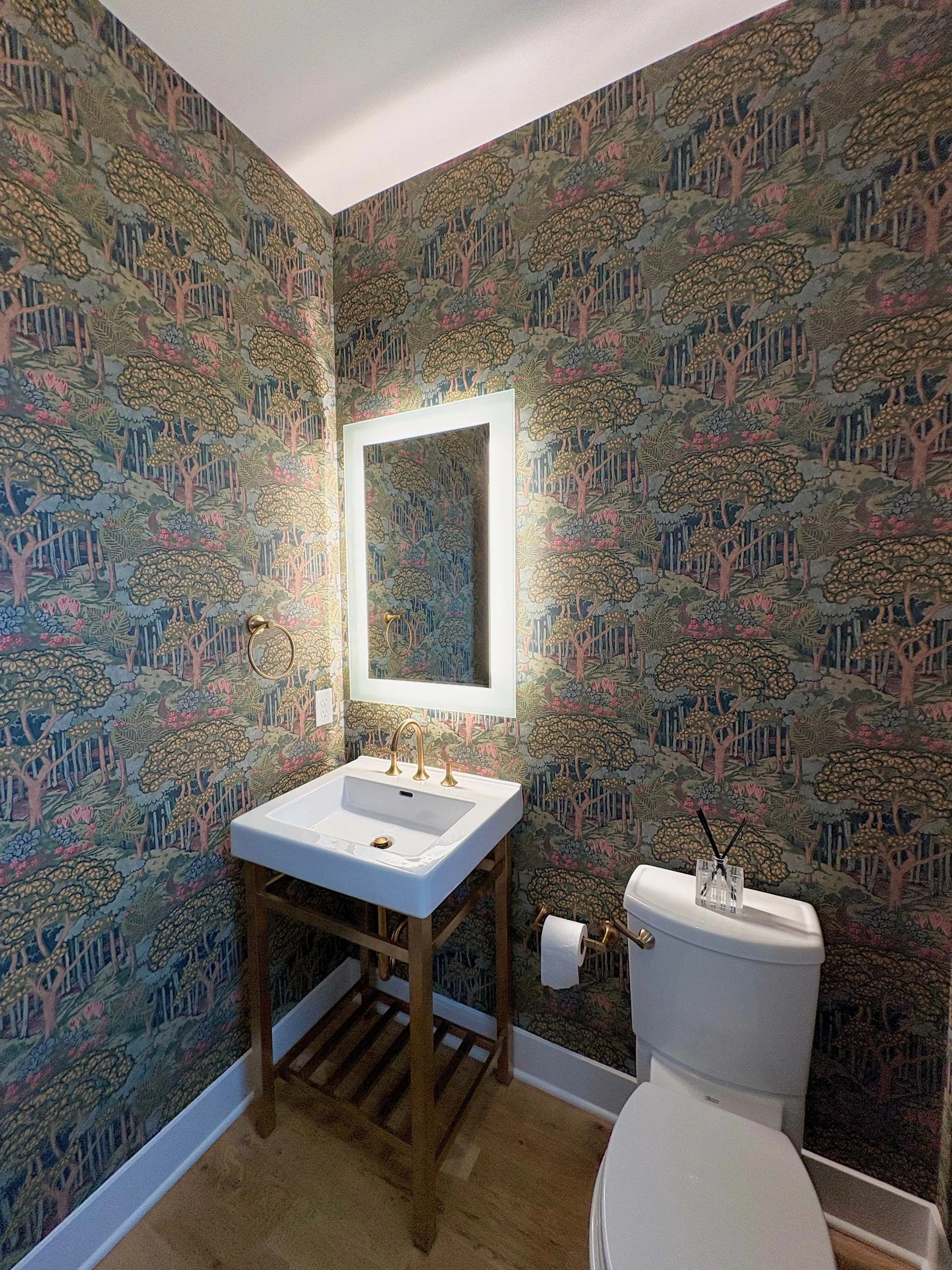 A bold, multi-colored floral wall covering expertly applied by a professional wallpaper installer.